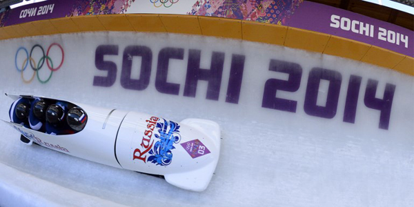 FILES) This file photo taken on February 23, 2014 shows Gold Medallist, Russia-1 four-man bobsleigh, pilot Alexander Zubkov, pushman Alexey Negodaylo, pushman Dmitry Trunenkov and brakeman Alexey Voevoda competing in the Bobsleigh Four-man Heat 4 and final run at the Sanki Sliding Center during the Sochi Winter Olympics. Two more Russian bobsleighers from the Russian-hosted 2014 Sochi Winter Olympics, Trunenkov and Negodaylo, have been stripped of their gold medals for do