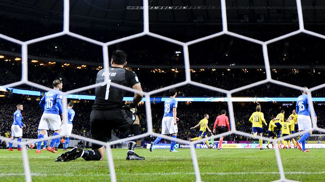 Sweden's midfielder Jakob Johansson celebrates with his teammates after scoring a goal past Italy's goalkeeper Gianluigi Buffon during the WC 2018 play-off football qualification match between Sweden and Italy in Solna, north of the capital Stockholm on November 10, 2017. Jonathan NACKSTRAND / AFP