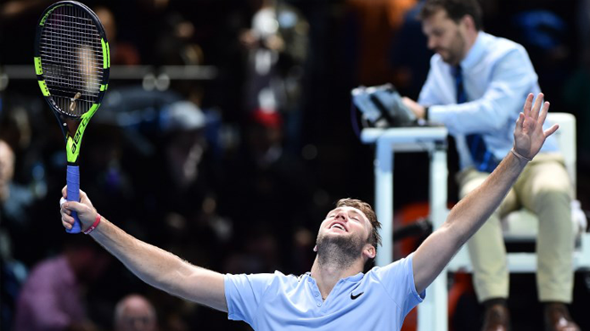US player Jack Sock celebrates beating Germany's Alexander Zverev in three sets in their men's singles round-robin match on day five of the ATP World Tour Finals tennis tournament at the O2 Arena in London on November 16 2017. Glyn KIRK / AFP