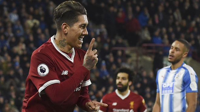 Liverpool's Brazilian midfielder Roberto Firmino celebrates scoring their second goal during the English Premier League football match between Huddersfield Town and Liverpool at the John Smith's stadium in Huddersfield, northern England on January 30, 2018. PAUL ELLIS / AFP