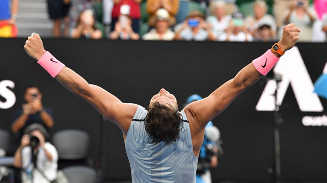 Spain's Rafael Nadal celebrates victory against Argentina's Diego Schwartzman during their men's singles fourth round match on day seven of the Australian Open tennis tournament in Melbourne on January 21, 2018. SAEED KHAN / AFP