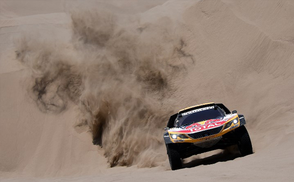Peugeot's driver Stephane Peterhansel and his co-driver Jean Paul Cottret of France, compete during the Stage 4 of the 2018 Dakar Rally in and around San Juan de Marcona, Peru, on January 9, 2018. FRANCK FIFE / AFP