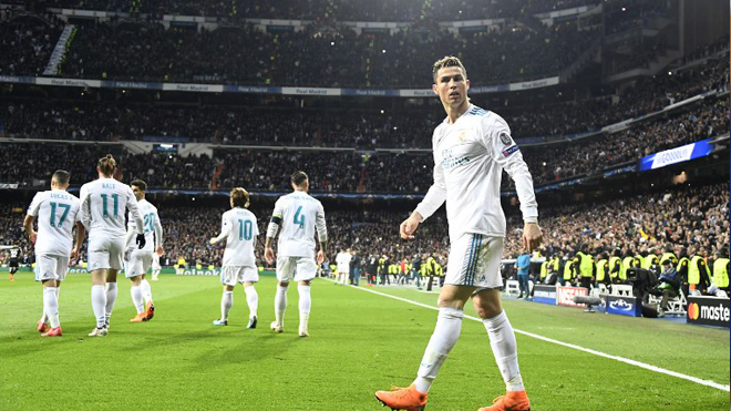 Real Madrid's Portuguese forward Cristiano Ronaldo walks on the pitch during the UEFA Champions League round of sixteen first leg football match Real Madrid CF against Paris Saint-Germain (PSG) at the Santiago Bernabeu stadium in Madrid on February 14, 2018. GABRIEL BOUYS / AFP