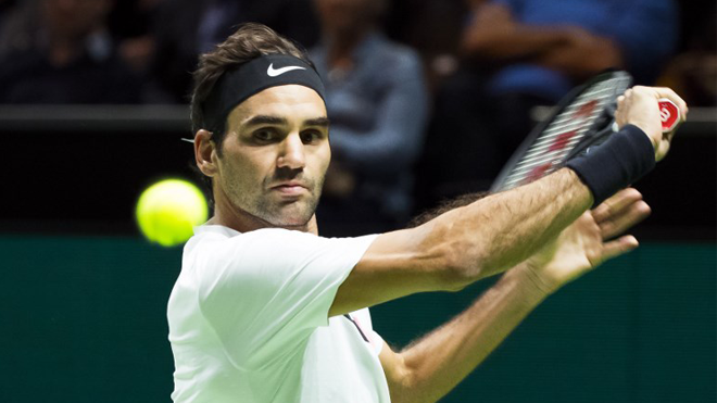 Roger Federer of Switzerland plays a backhand return to Philipp Kohlschreiber of Germany during their second round singles match for the ABN AMRO World Tennis Tournament in Rotterdam on February 15, 2018. Koen Suyk / ANP / AFP