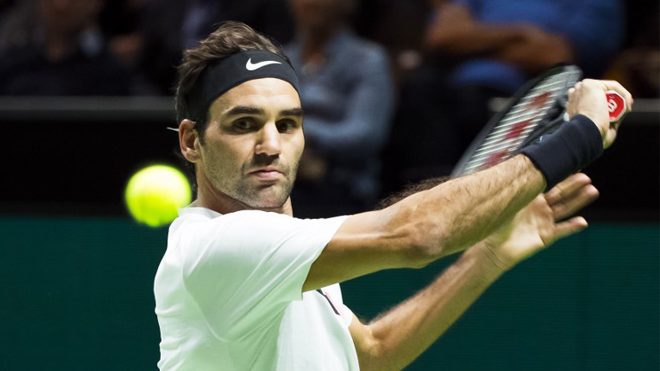 Roger Federer of Switzerland plays a backhand return to Philipp Kohlschreiber of Germany during their second round singles match for the ABN AMRO World Tennis Tournament in Rotterdam on February 15, 2018. Koen Suyk / ANP / AFP