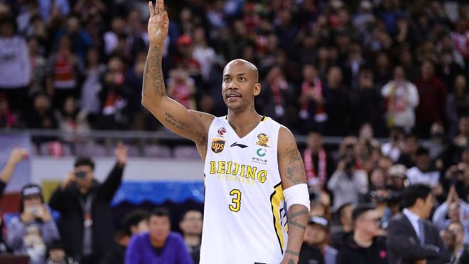 Former NBA player Stephon Marbury waves to the crowd after his final game for the Chinese Basketball Association's Beijing Fly Dragons in Beijing on February 11, 2018. Marbury retired from pro basketball on February 11, 2018 after a 22-year career. AFP