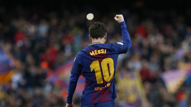 Barcelona's Argentinian forward Lionel Messi celebrates after scoring during the Spanish league football match FC Barcelona against Club Atletico de Madrid at the Camp Nou stadium in Barcelona on March 04, 2018. Pau Barrena / AFP