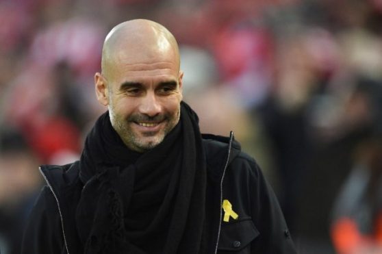 (FILES) In this file photo taken on January 14, 2018 Manchester City's Spanish manager Pep Guardiola arrives for the English Premier League football match between Liverpool and Manchester City at Anfield in Liverpool, north west England.