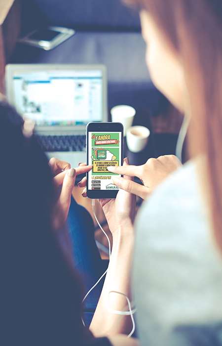 Two women having fun at the cafe and looking at smart phone. Woman showing something to her friends sitting.