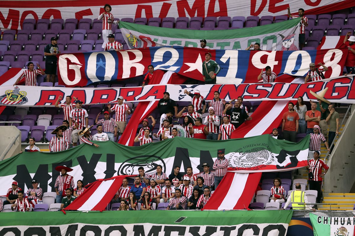 Guadalajara supporters cheer for their team during the second round match of the FIFA Club World Cup 2018 football tournament between Japan's Kashima Antlers and Mexico's C.D. Guadalajara at the Hazza Bin Zayed Stadium in Abu Dhabi, the capital of the United Arab Emirates, on December 15, 2018. (Photo by Karim Sahib / AFP)