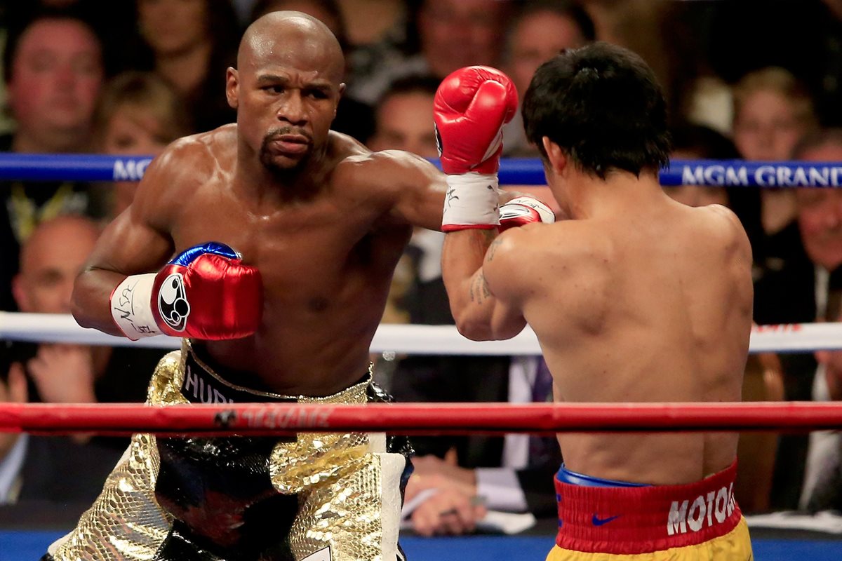 El combate entre el boxeador invicto y el campeón irlandés de las artes marciales mixtas podrá verse mediante televisión de alta definición. (Foto Prensa Libre: AFP)