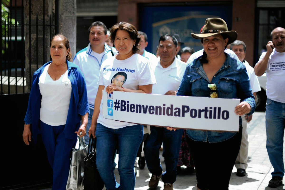 Integrantes del Frente Portillista se reunieron ayer en diferentes partes del país para manifestar su felicidad por el regreso del expresidente Alfonso Portillo a Guatemala, luego de cumplir una condena de prisión en Estados Unidos   (Foto Prensa Libre: AFP)