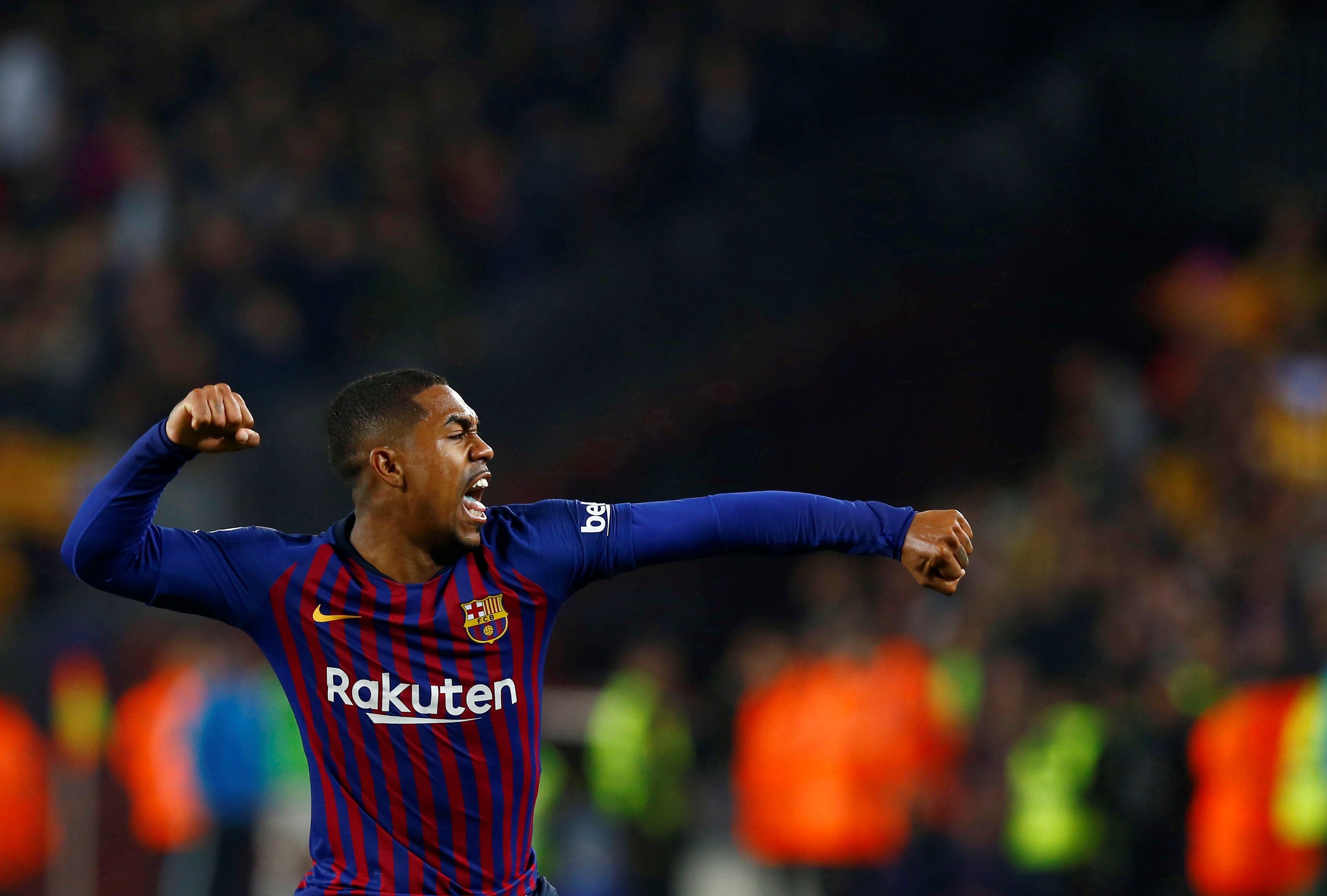  El delantero brasileño del FC Barcelona Malcom Silva celebra tras marcar ante el Real Madrid. (Foto Prensa Libre: EFE)