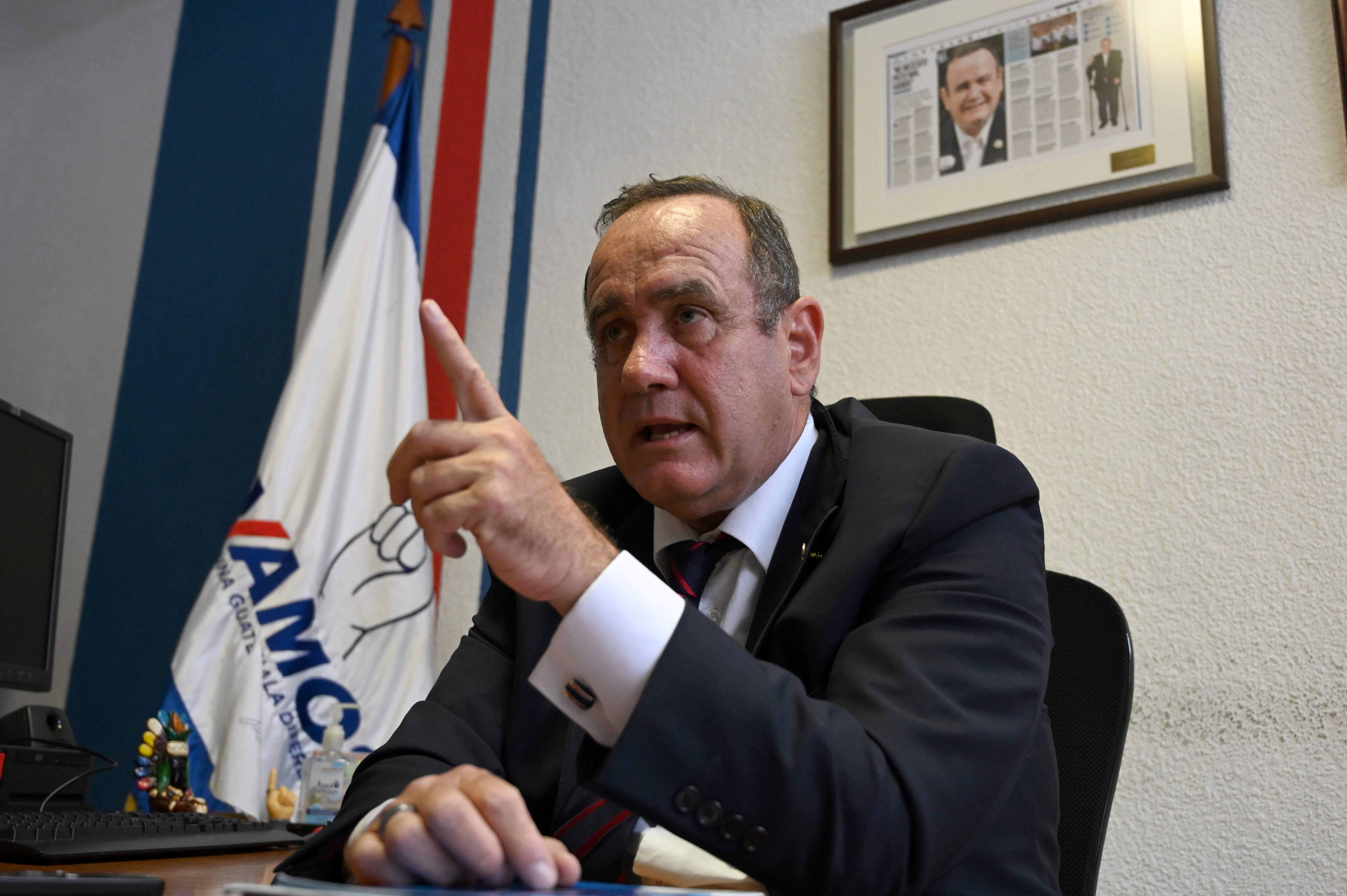 Guatemalan presidential candidate for the Vamos party, Alejandro Giammattei, offers an interview to AFP at his office in Guatemala City, on June 12, 2019, ahead of the June 16 general election. - Right-wing candidate Alejandro Giammattei runs second behind Sandra Torres, a former first lady, in the polls of the presidential election to replace the incumbent Jimmy Morales, but Roberto Arzu, son of late President (1996-2000) Alvaro Arzu, threatens to displace him. A run-off round will be held on August 11 if no candidate reaches a majority in Sunday's vote. (Photo by Johan ORDONEZ / AFP)