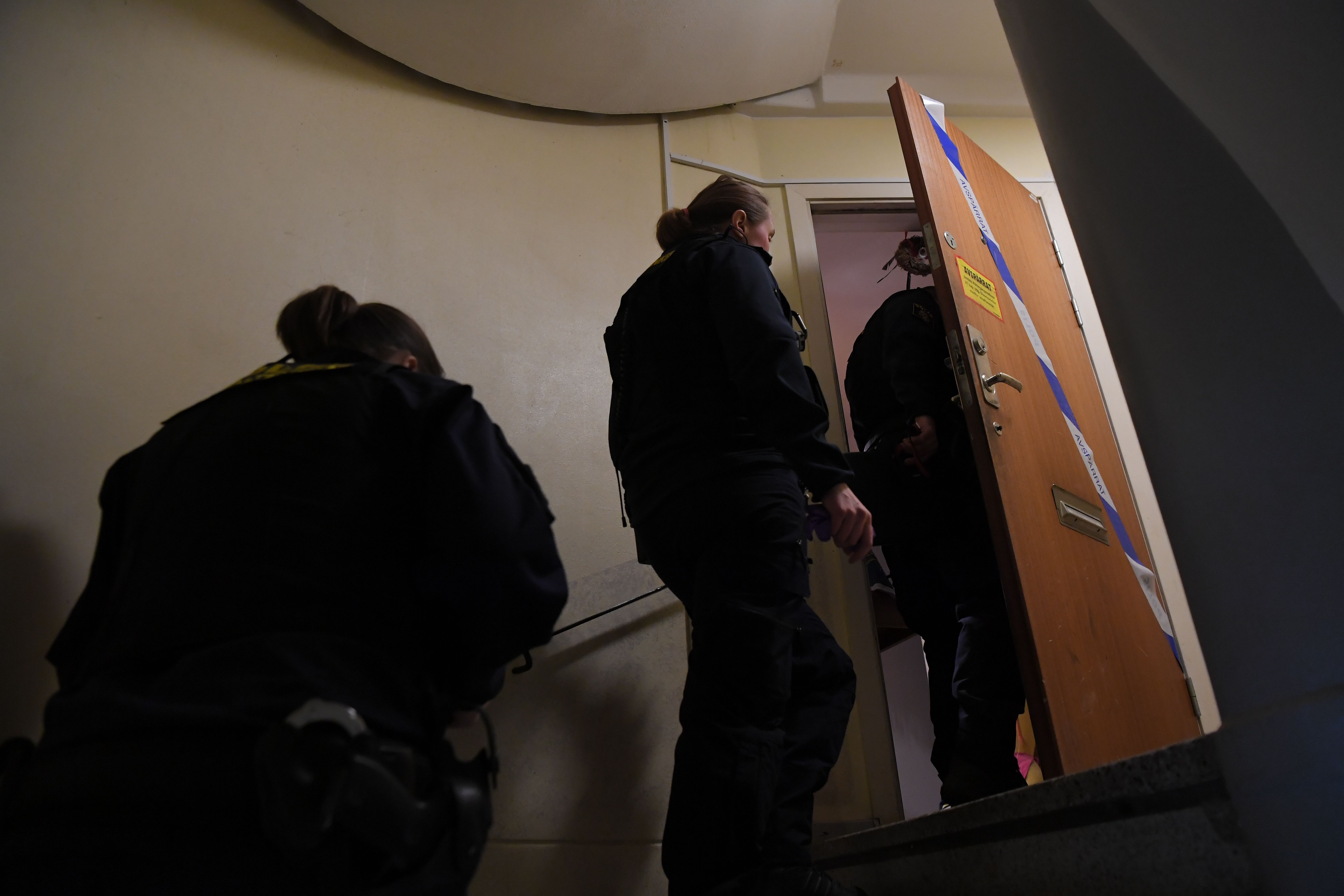 Police technicians enter an apartment in Haninge, south of Stockholm, on December 1, 2020, one day after a man in his 40s who was kept locked by his mother was found there. - A mother in Sweden has been arrested on suspicion of locking her son inside their apartment for 28 years, leaving him undernourished and with almost no teeth, police and media reports said. (Photo by Jonathan NACKSTRAND / AFP)