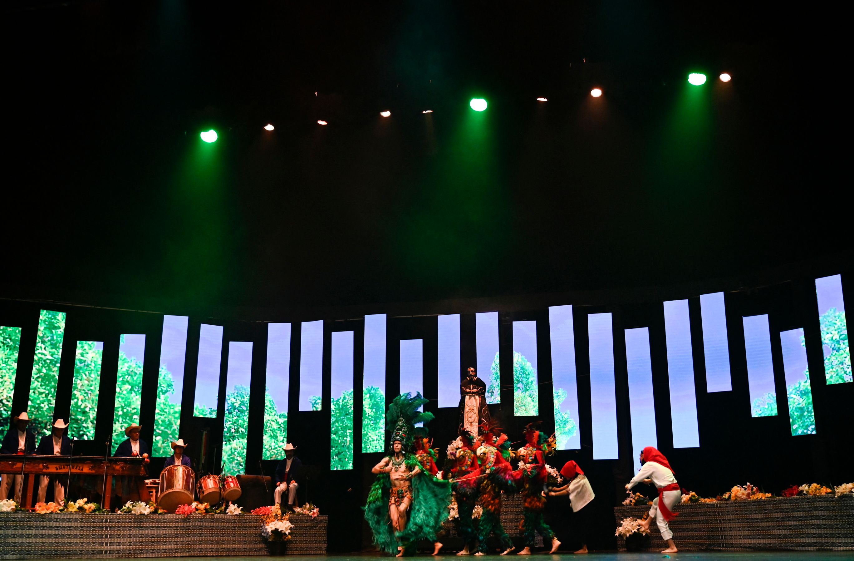 Members of the National Modern and Folkloric Ballet of Guatemala perform the traditional Mayan Q'eqchi' dance "El Paabanc" at the Miguel Angel Asturias Cultural Centre in Guatemala City, on August 7, 2022. - The dance "El Paabanc", whose tradition is celebrated by the indigenous people of the Q'eqchi' Mayan ethnic group in the department of Alta Verapaz, in northern Guatemala, was declared as "Intangible Cultural Heritage of the Nation", according to a report published on August 4 by the Sports and Culture Ministry. (Photo by Johan ORDONEZ / AFP)