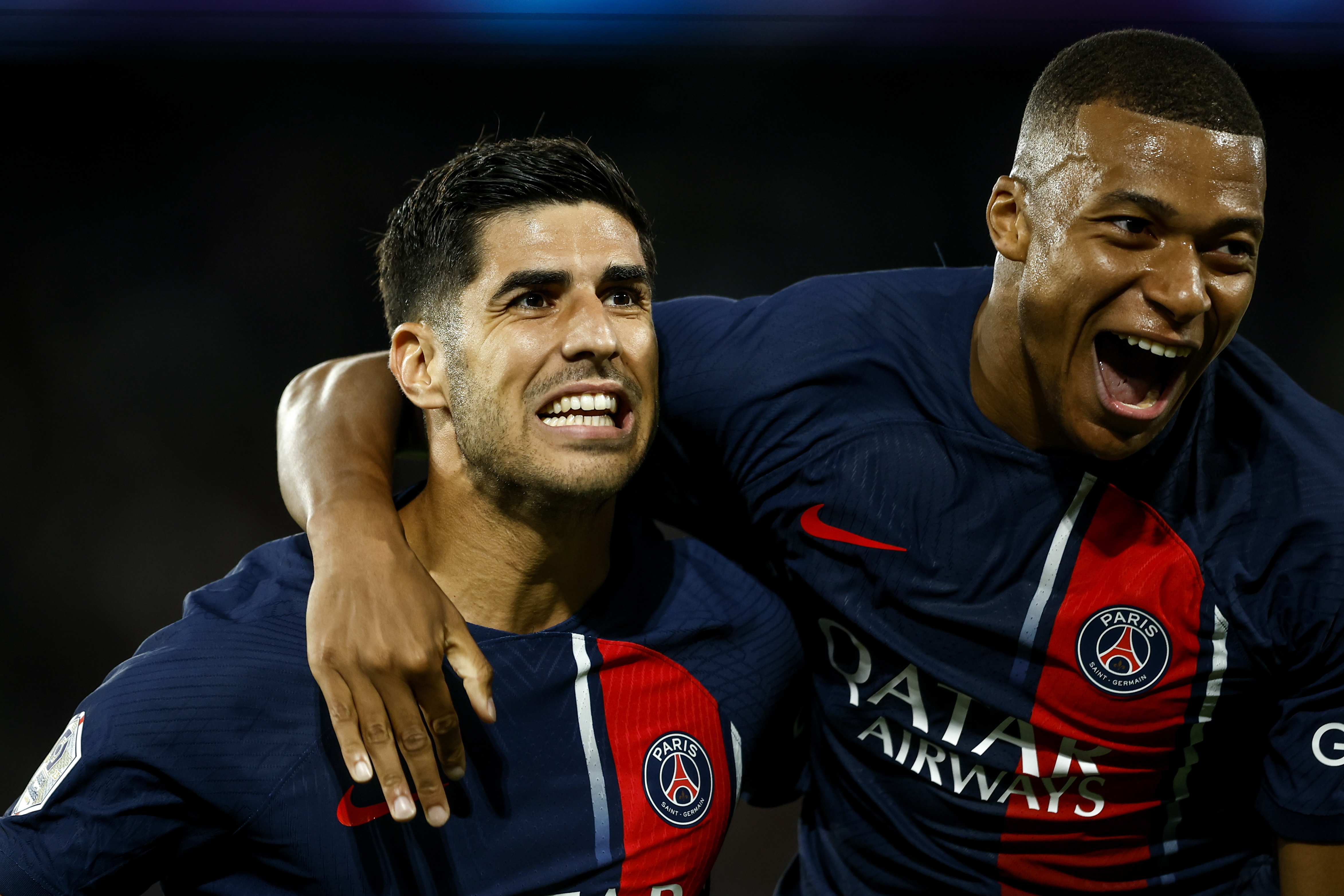 Asensio y Mbappé celebrando sus anotaciones.