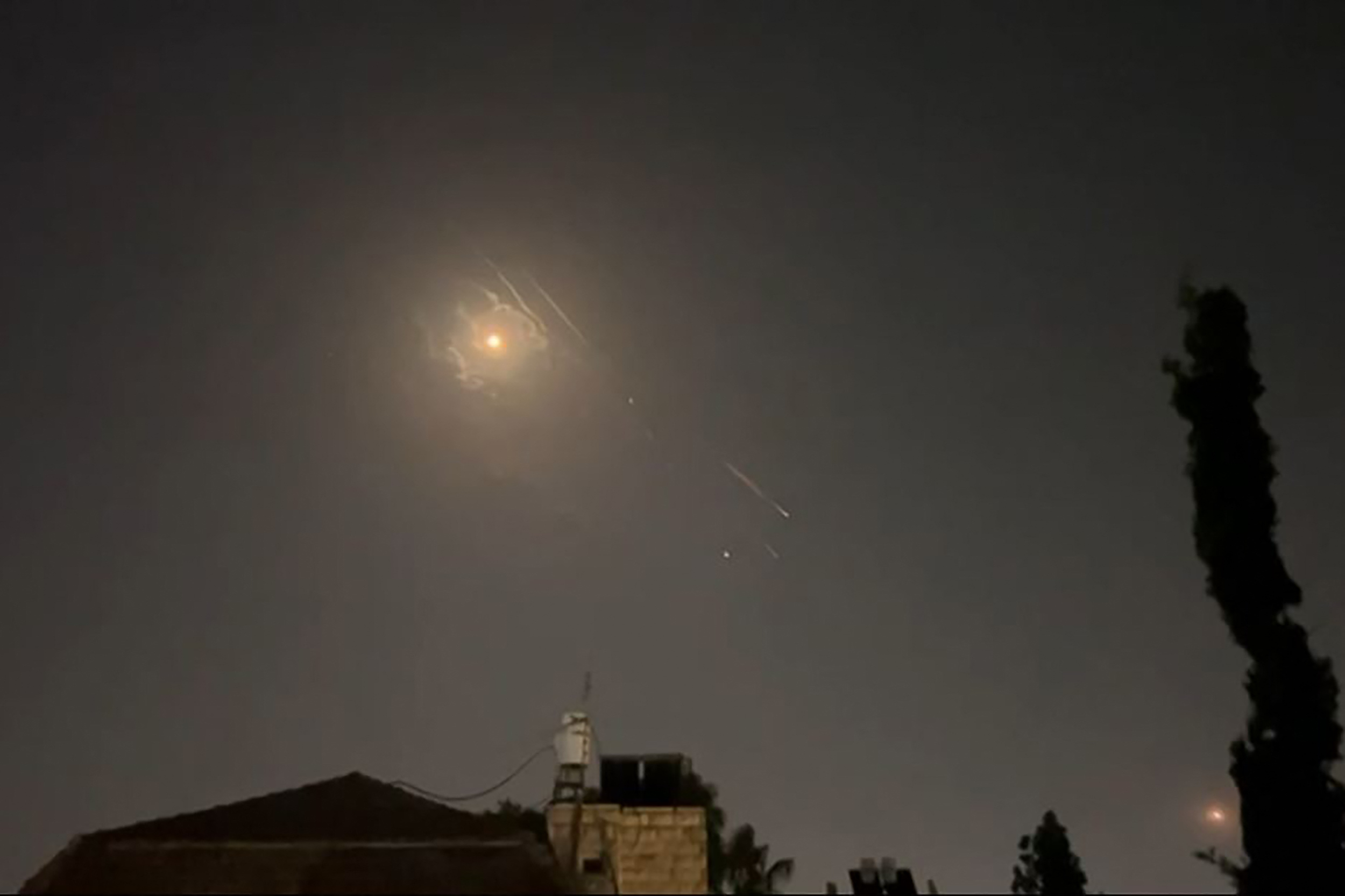 This video grab from AFPTV taken on April 14, 2024 shows explosions lighting up Jerusalem sky during Iranian attack on Israel. Iran's Revolutionary Guards confirmed early April 14, 2024 that a drone and missile attack was under way against Israel in retaliation for a deadly April 1 drone strike on its Damascus consulate. (Photo by AFPTV / AFP)