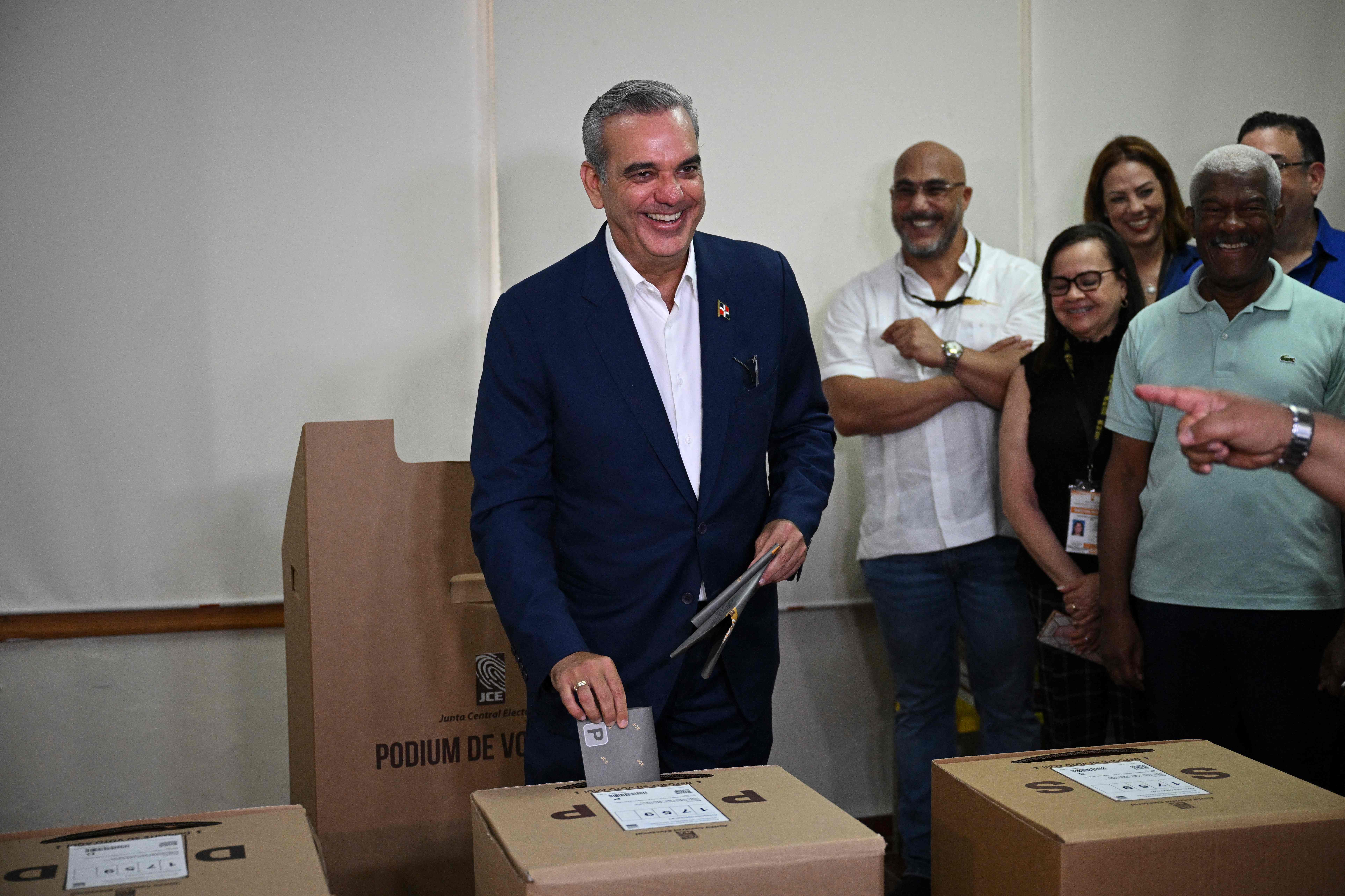 Dominican Republic's President and presidential candidate for the Modern Revolutionary Party (PRM), Luis Abinader, casts his ballots at a polling station during the general elections in Santo Domingo on May 19, 2024. Polls opened in the Dominican Republic on Sunday, where President Luis Abinader is poised for comfortable reelection on the back of widespread support for his tough stance on migration from troubled neighbor Haiti. (Photo by Federico PARRA / AFP)