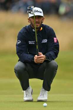 US golfer Max Homa lines up a putt on the 4th green on the opening day of the 152nd British Open Golf Championship at Royal Troon on the south west coast of Scotland on July 18, 2024. (Photo by Glyn KIRK / AFP) / RESTRICTED TO EDITORIAL USE