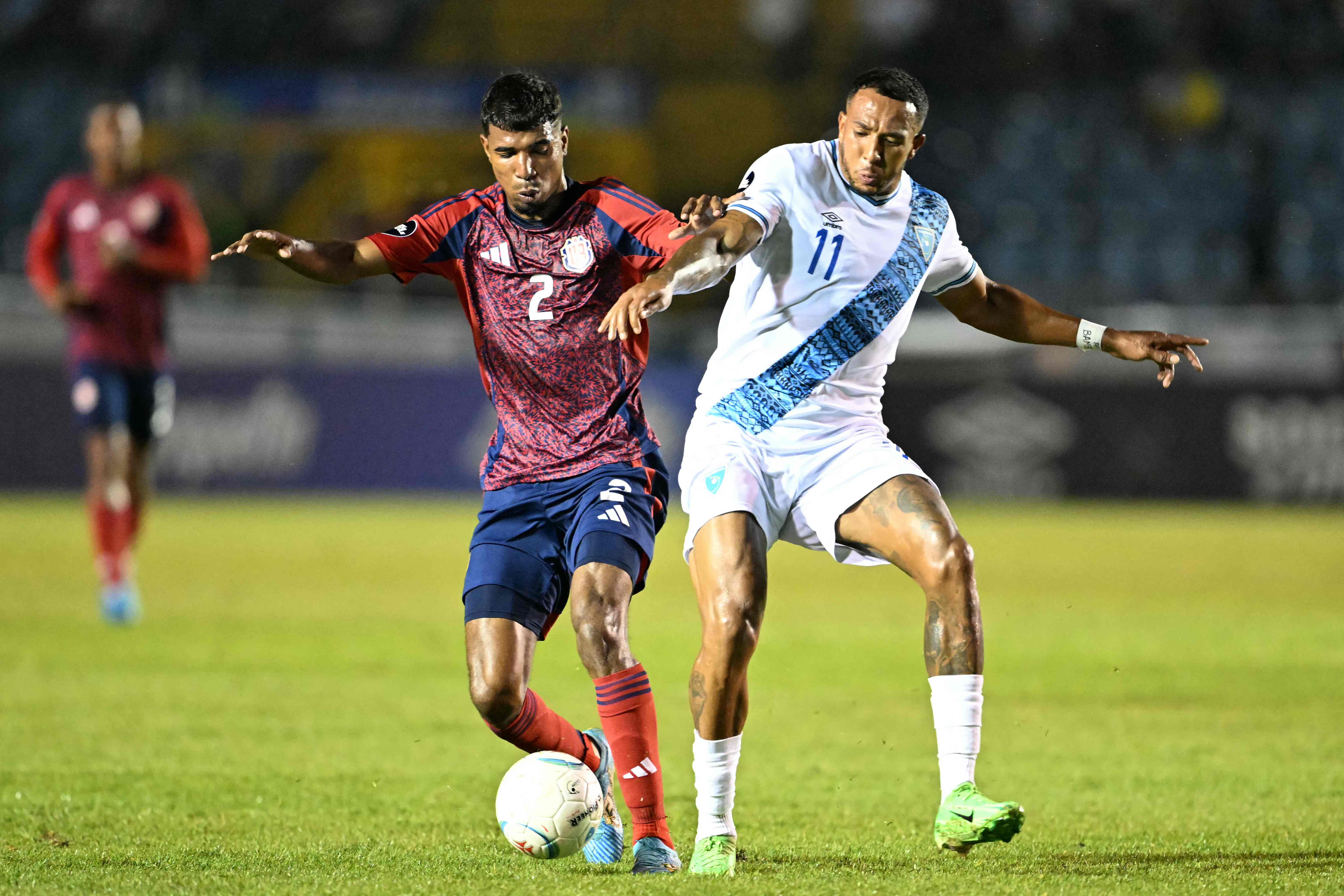 Costa Rica's defender Gerald Taylor (L) and Guatemala's forward Nathaniel Mendez fight for the ball during the Concacaf Nations League group stage football match between Guatemala and Costa Rica at the Doroteo Guamuch Flores stadium in Guatemala City, on September 9, 2024. (Photo by JOHAN ORDONEZ / AFP)