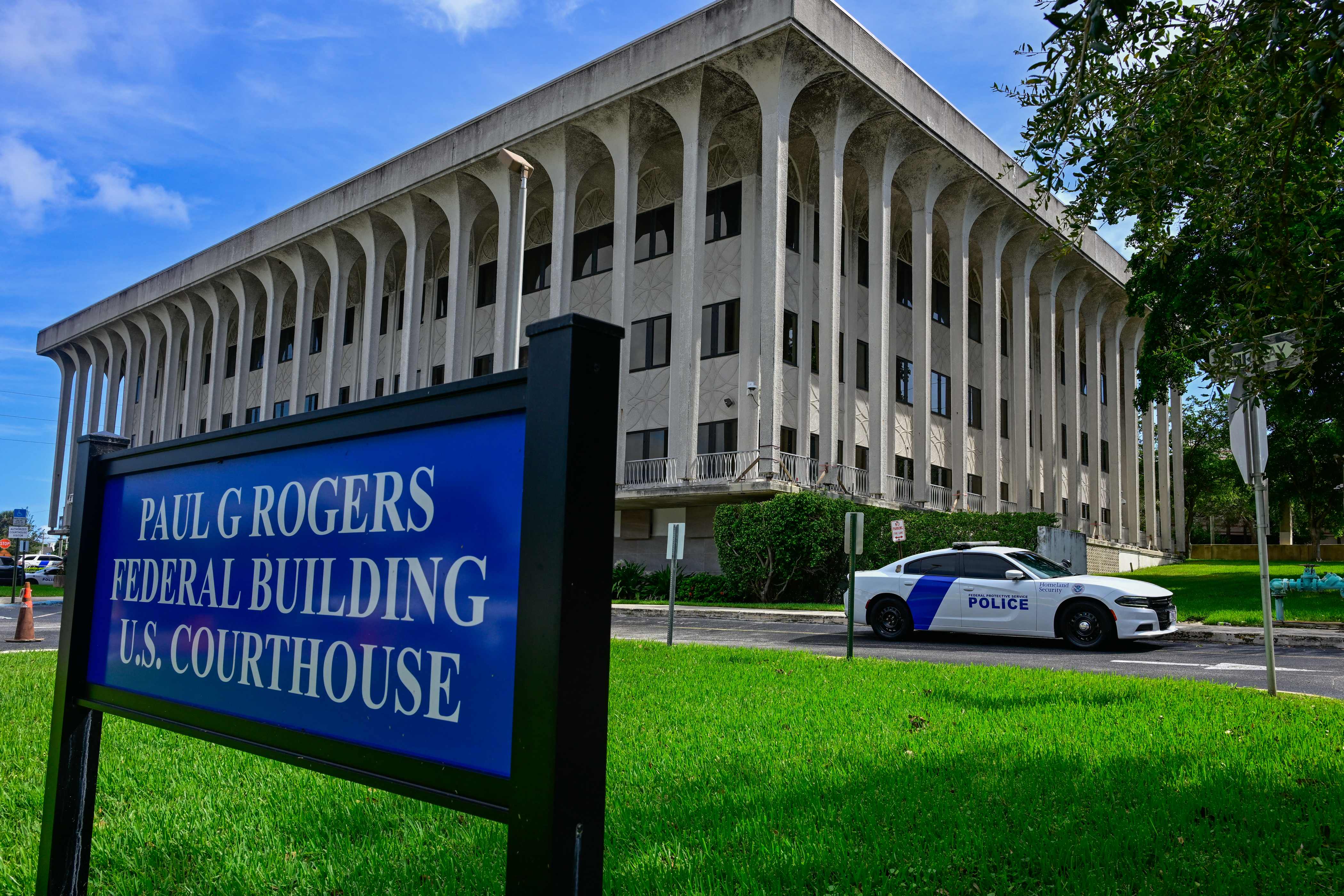 A view of the Paul G. Rogers Federal Building and US Courthouse during a hearing on the detention of Ryan Wesley Routh, suspected of the attempted assassination of former US president Donald Trump, in West Palm Beach, Florida, on September 30, 2024. Ryan Wesley Routh, 58, was charged with possession of a firearm as a convicted felon and possession of a firearm with an obliterated serial number at his initial court appearance. (Photo by Giorgio VIERA / AFP)