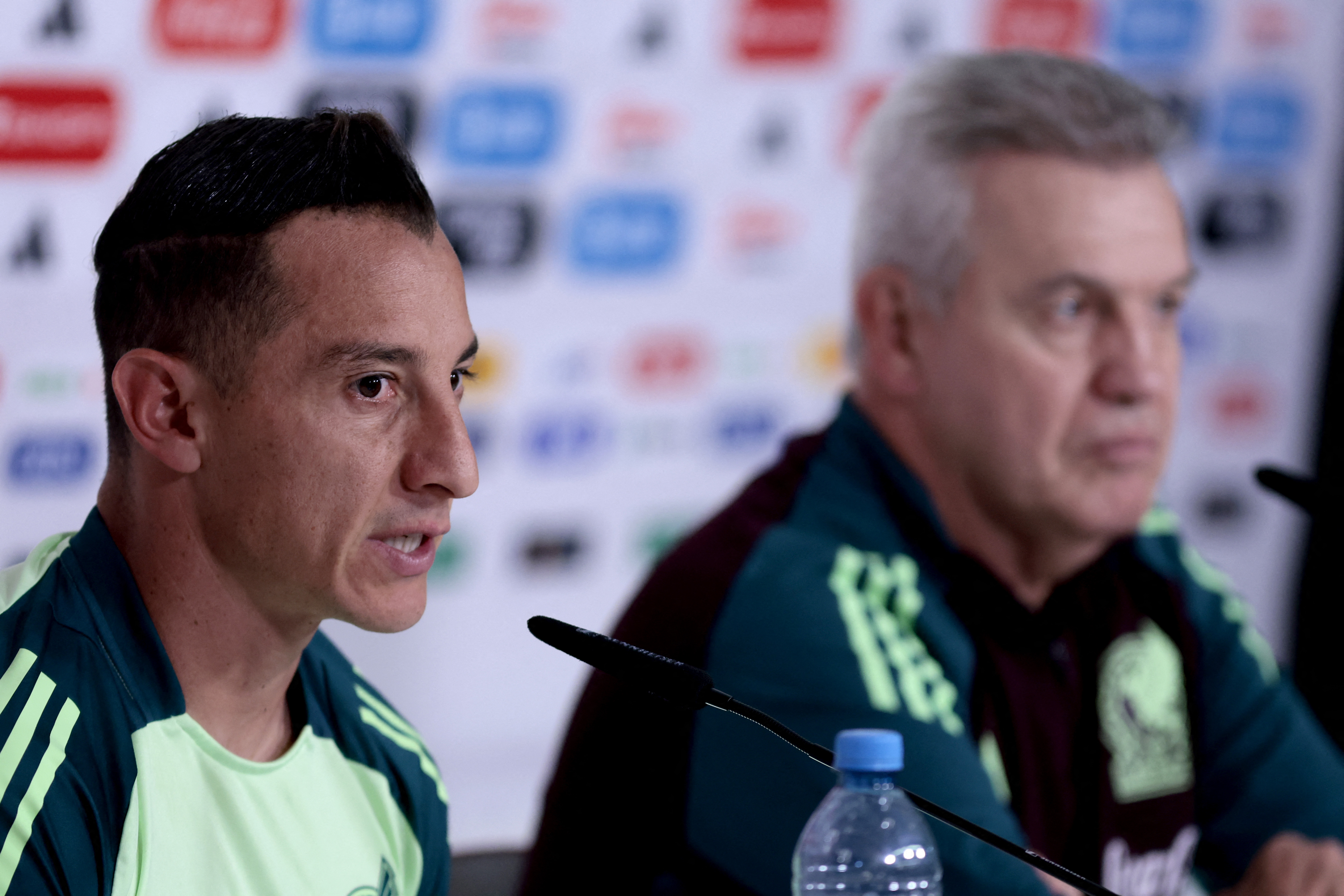 Mexico's midfielder Andres Guardado (L) speaks next to coach Javier Aguirre during a press conference at the Akron Stadium in Zapopan, Jalisco state, Mexico, on October 14, 2024, ahead of the friendly football match between Mexico and the US. (Photo by ULISES RUIZ / AFP)