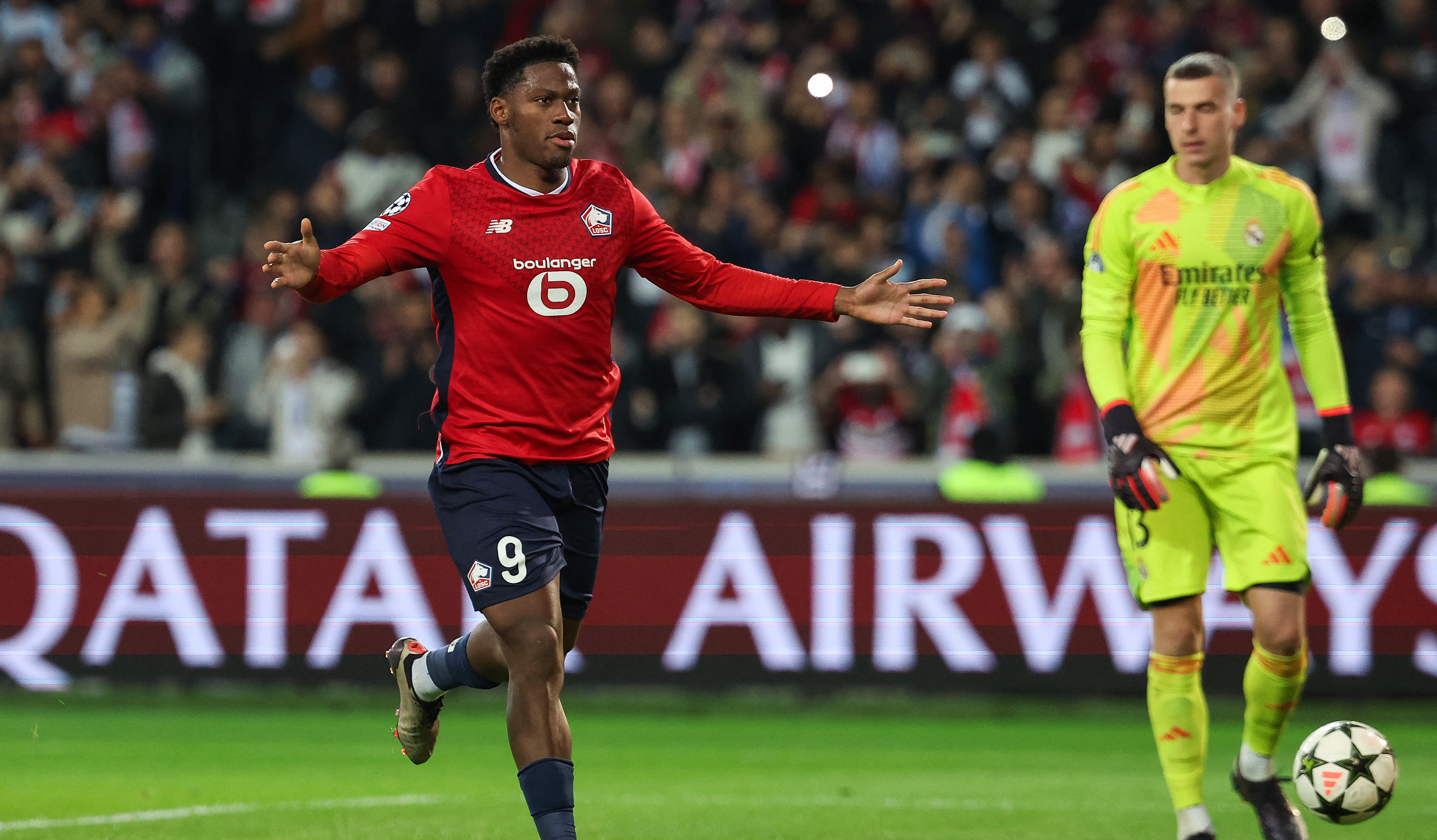 Lille's Canadian forward #09 Jonathan David celebrates scoring his team's first goal from the penalty spot during the UEFA Champions League football match between Lille LOSC and Real Madrid at the Pierre Mauroy Stadium in Villeneuve-d'Ascq, northern France, on October 2, 2024. (Photo by FRANCK FIFE / AFP)