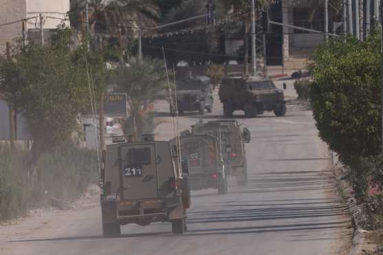 Tulkarem (--), 07/11/2024.- Israeli military vehicles on a street during a raid carried out by Israeli forces in the West Bank city of Tulkarem, 07 November 2024. According to the Palestinian Health Ministry in the West Bank, at least one Palestinian was killed while some five others were injured during the raid in Tulkarem and its refugee camp. Since 07 October 2023, nearly 800 Palestinians, including over 150 children, have been killed and around 6,500 have been injured across the West Bank and Jerusalem. (Jerusalén) EFE/EPA/ALAA BADARNEH