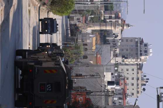 Tulkarem (--), 07/11/2024.- Israeli military vehicles on a street during a raid carried out by Israeli forces in the West Bank city of Tulkarem, 07 November 2024. According to the Palestinian Health Ministry in the West Bank, at least one Palestinian was killed while some five others were injured during the raid in Tulkarem and its refugee camp. Since 07 October 2023, nearly 800 Palestinians, including over 150 children, have been killed and around 6,500 have been injured across the West Bank and Jerusalem. (Jerusalén) EFE/EPA/ALAA BADARNEH