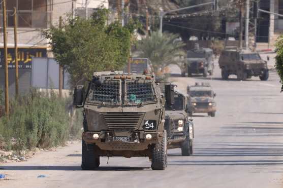 Tulkarem (--), 07/11/2024.- Israeli military vehicles on a street during a raid carried out by Israeli forces in the West Bank city of Tulkarem, 07 November 2024. According to the Palestinian Health Ministry in the West Bank, at least one Palestinian was killed while some five others were injured during the raid in Tulkarem and its refugee camp. Since 07 October 2023, nearly 800 Palestinians, including over 150 children, have been killed and around 6,500 have been injured across the West Bank and Jerusalem. (Jerusalén) EFE/EPA/ALAA BADARNEH