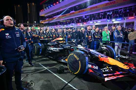 The team of Red Bull Racing's Dutch driver Max Verstappen listen to the US National Anthem before the start of the Las Vegas Formula One Grand Prix in Las Vegas, Nevada on November 23, 2024. (Photo by Frederic J. Brown / AFP)