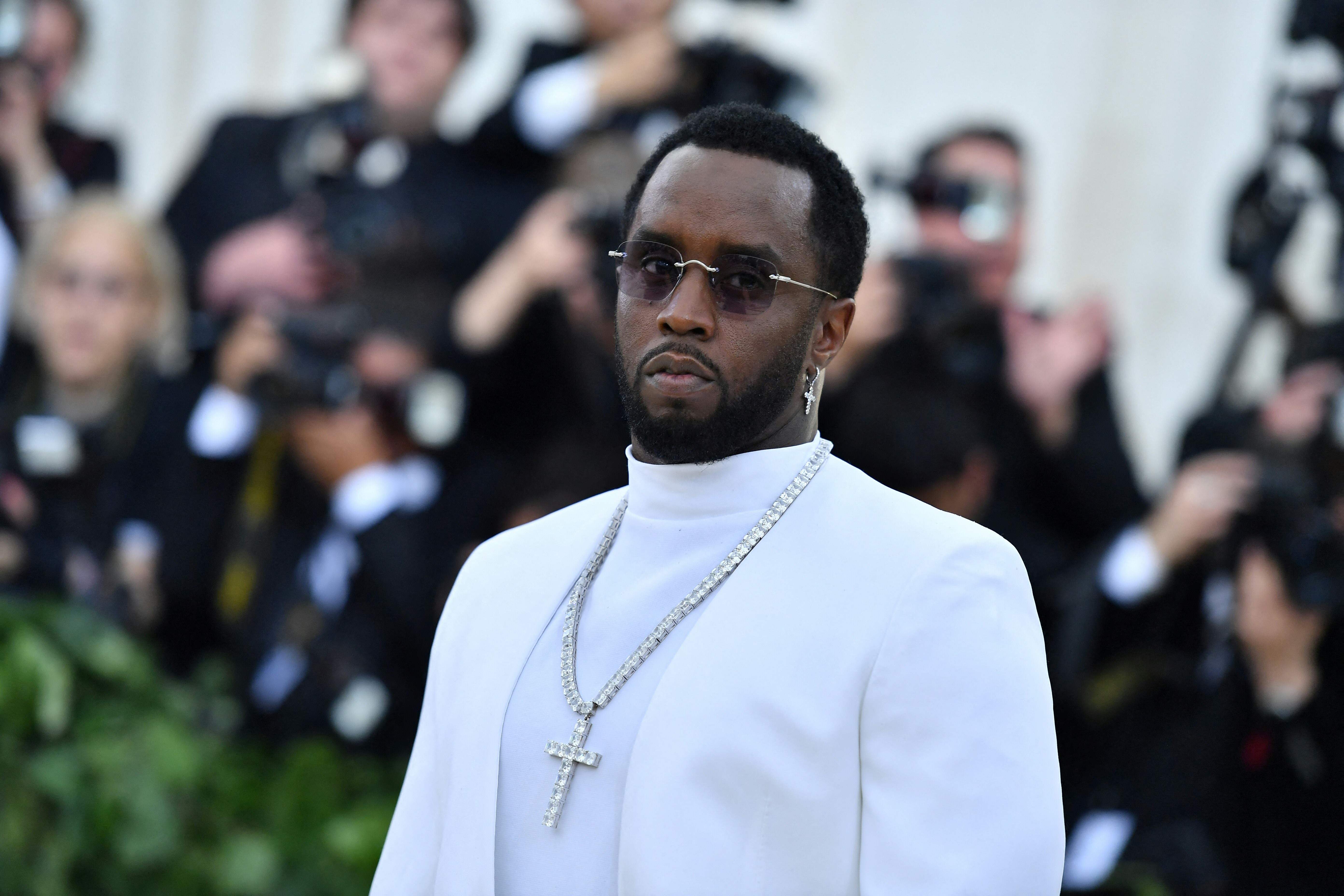 (FILES) Sean Combs arrives for the 2018 Met Gala on May 7, 2018, at the Metropolitan Museum of Art in New York. Music mogul Sean Combs is set to go on trial for racketeering and sex trafficking on May 5, 2025, a judge said in a court hearing October 10, 2024. The rapper known as "Diddy" will remain incarcerated, said federal judge Arun Subramanian, after he was indicted last month on three criminal counts that allege he sexually abused women and coerced them into drug-fueled sex parties using threats and violence. (Photo by Angela WEISS / AFP)