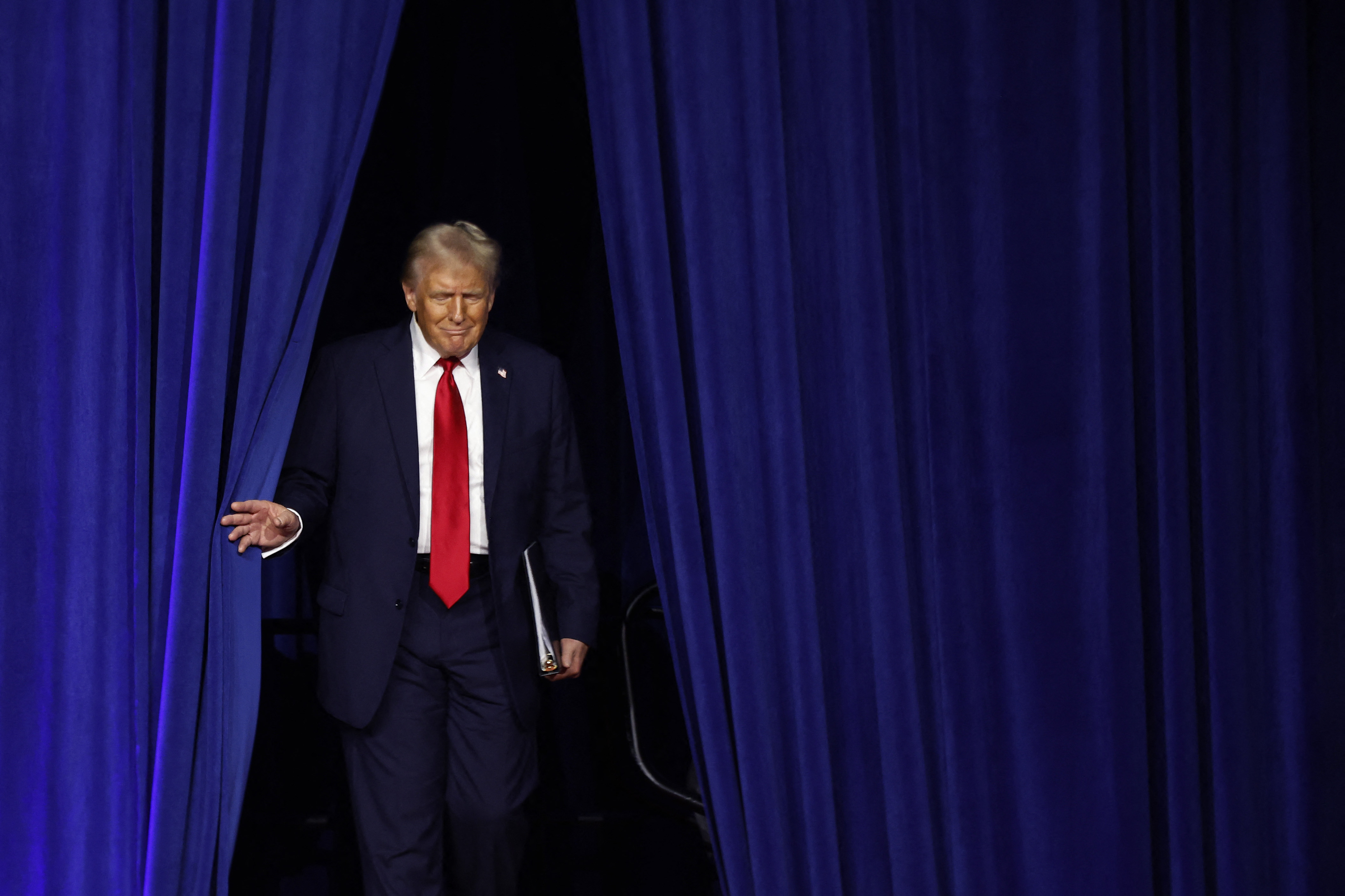 WEST PALM BEACH, FLORIDA - NOVEMBER 05: Republican presidential nominee, former U.S. President Donald Trump arrives to speak during an election night event at the Palm Beach Convention Center on November 06, 2024 in West Palm Beach, Florida. Americans cast their ballots today in the presidential race between Republican nominee former President Donald Trump and Vice President Kamala Harris, as well as multiple state elections that will determine the balance of power in Congress.   Chip Somodevilla/Getty Images/AFP (Photo by CHIP SOMODEVILLA / GETTY IMAGES NORTH AMERICA / Getty Images via AFP)