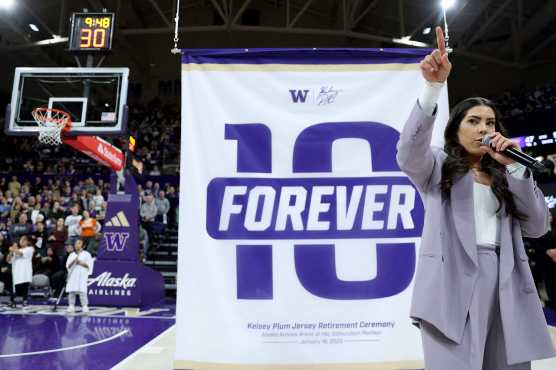 SEATTLE, WASHINGTON - JANUARY 18: Former Washington Huskies womens basketball player Kelsey Plum reacts during her #10 jersey retirement ceremony during halftime between the Washington Huskies Purdue Boilermakers at Alaska Airlines Arena on January 18, 2025 in Seattle, Washington. At Washington (2013-17), Plum became the all-time NCAA scoring leader (3,527 points  stood until 2024) and broke the 33-year-old NCAA career free throw record (912).   Steph Chambers/Getty Images/AFP (Photo by Steph Chambers / GETTY IMAGES NORTH AMERICA / Getty Images via AFP)