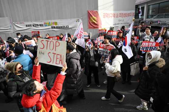 Pro-Yoon supporters demonstrate outside the Seoul Western District Court in Seoul on January 18, 2025, as the court weighs whether to extend the detention of impeached South Korea President Yoon Suk Yeol, after investigators arrested him over a failed martial law bid. Yoon, who has claimed his arrest and investigation is illegal, threw the nation into chaos on December 3 when he attempted to suspend civilian rule, citing the need to combat threats from "anti-state elements". (Photo by JUNG Yeon-je / AFP)