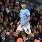 Manchester City's Uzbek defender #45 Abdukodir Khusanov runs with the ball during the English Premier League football match between Manchester City and Chelsea at the Etihad Stadium in Manchester, north west England, on January 25, 2025. (Photo by Oli SCARFF / AFP) / RESTRICTED TO EDITORIAL USE. No use with unauthorized audio, video, data, fixture lists, club/league logos or 'live' services. Online in-match use limited to 120 images. An additional 40 images may be used in extra time. No video emulation. Social media in-match use limited to 120 images. An additional 40 images may be used in extra time. No use in betting publications, games or single club/league/player publications. /