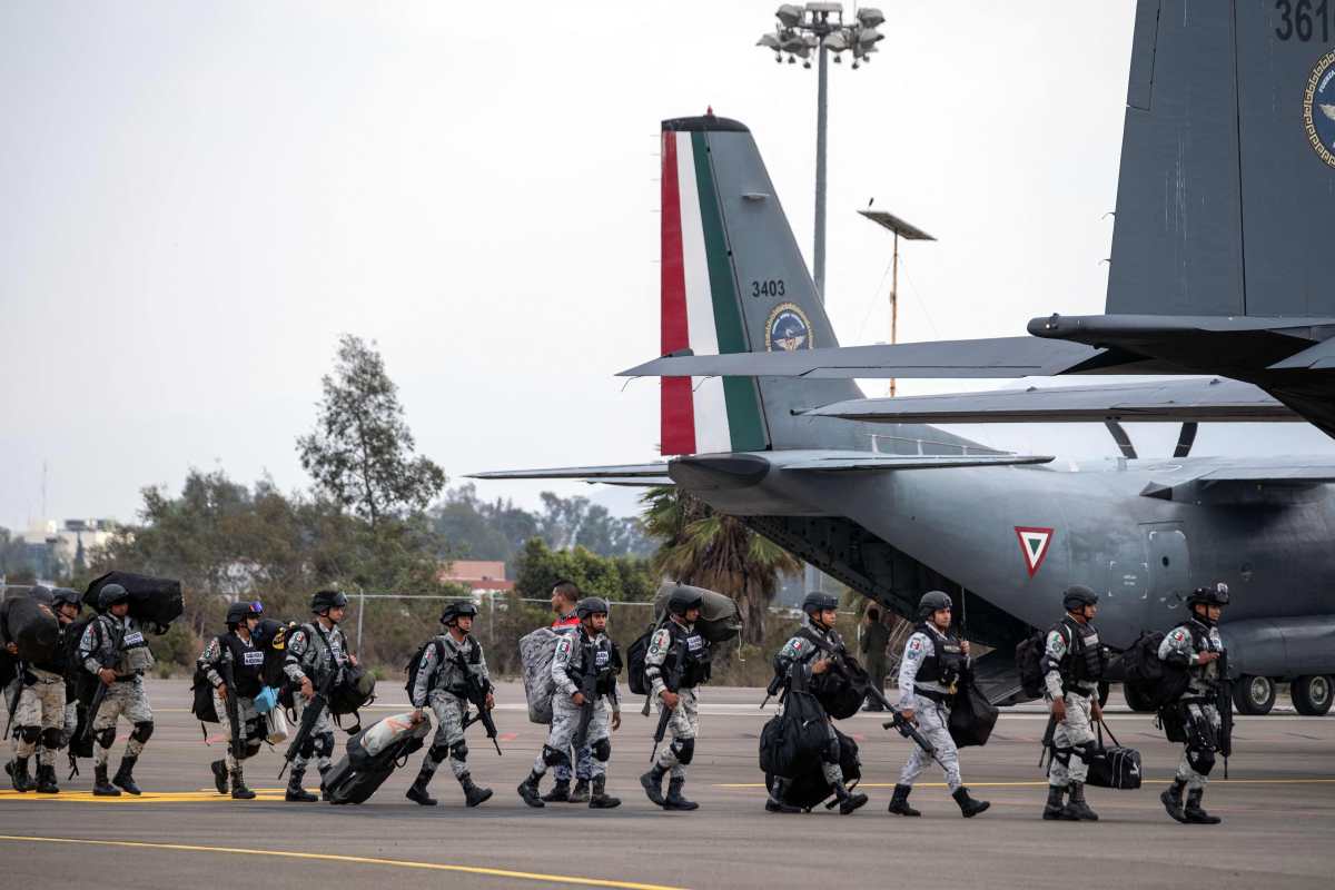 Mexico's National Guard officers arrive at Tijuana International Airport in Tijuana, Baja California state, Mexico, on February 4, 2025. Mexico began the 10,000-strong border troop deployment it had promised US President Donald Trump in exchange for delaying a 25-percent tariff on exported goods, President Claudia Sheinbaum said. (Photo by Guillermo Arias / AFP)