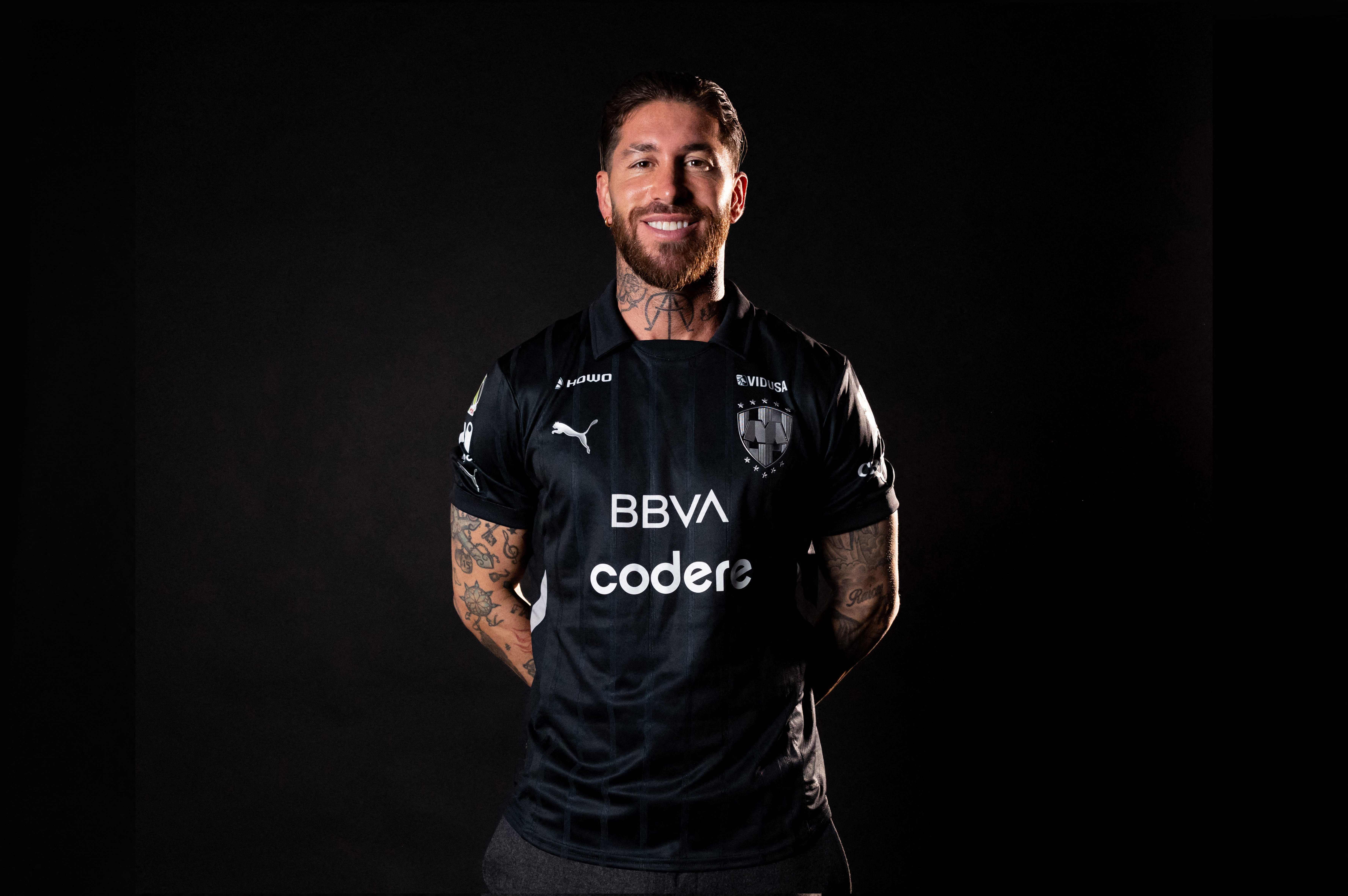 This handout picture released by Monterrey Rayados football club shows new signing Spanish football player Sergio Ramos posing for a picture wearing the team Jersey in Madrid on February 5, 2025. Spanish football player Sergio Ramos is the new signing of Rayados de Monterrey of Mexico's La Liga, the club announced on its social networks on February 6, 2025, with a message in which it highlighted the Spaniard as a historic defender in world football. (Photo by Handout / Monterrey Rayados Football Club / AFP) / RESTRICTED TO EDITORIAL USE - MANDATORY CREDIT "AFP PHOTO /  MONTERREY RAYADOS FOOTBALL CLUB  / HANDOUT /  " - NO MARKETING NO ADVERTISING CAMPAIGNS - DISTRIBUTED AS A SERVICE TO CLIENTS