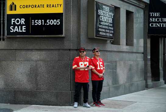 Kansas City Chiefs fans stand on a street corner in the French Quarter ahead of Super Bowl LIX, where the Kansas City Chiefs will play the Philadelphia Eagles, in New Orleans, Louisiana, on February 7, 2025. (Photo by TIMOTHY A. CLARY / AFP)