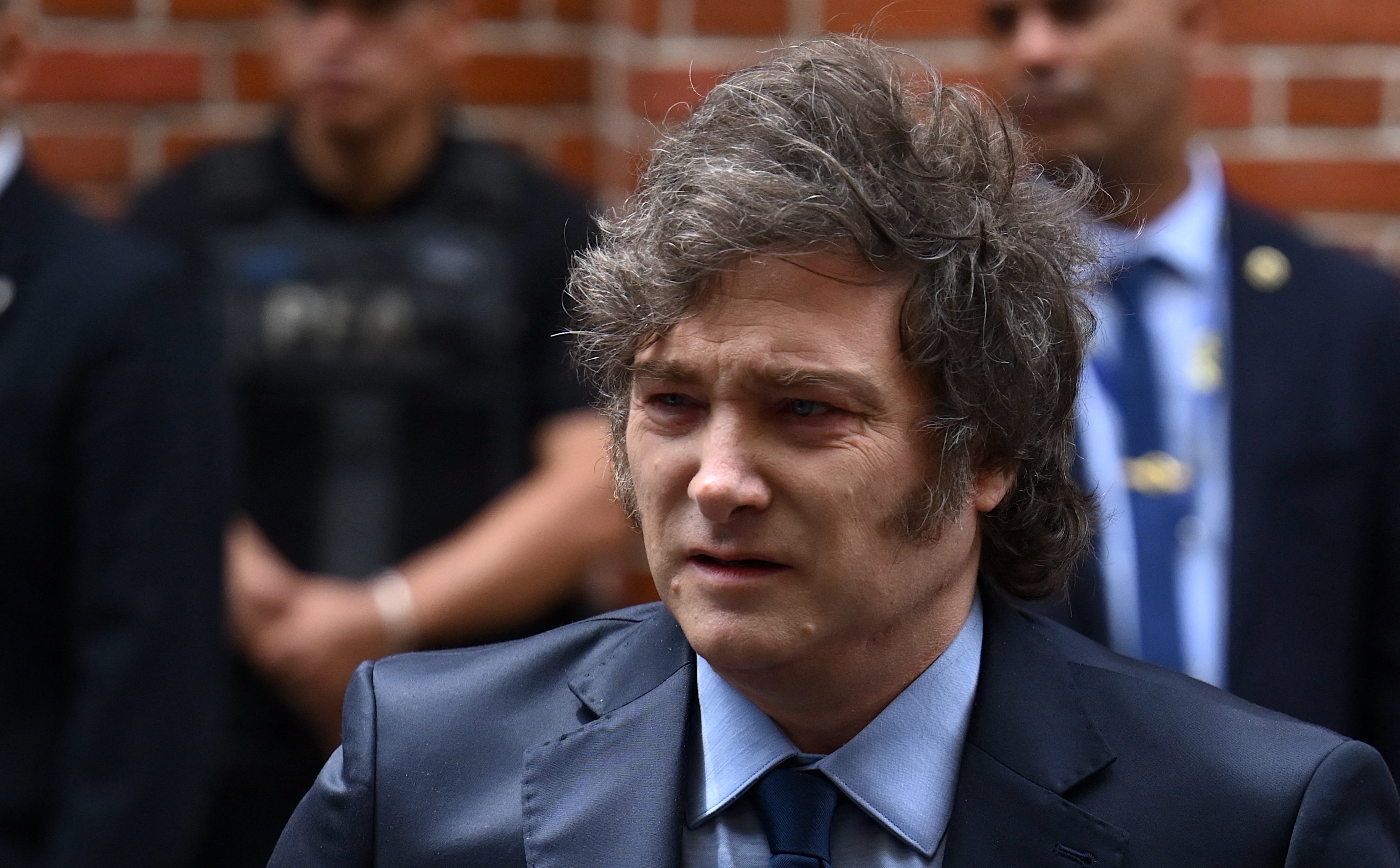 (FILES) Argentina's President Javier Milei leaves the Holocaust Museum after attending an event to commemorate International Holocaust Remembrance Day in Buenos Aires on January 27, 2025. Milei was facing criticism on February 15 after promoting a cryptocurrency whose value soared, then quickly tanked, sparking accusations of fraud and calls for an investigation. (Photo by Luis ROBAYO / AFP)