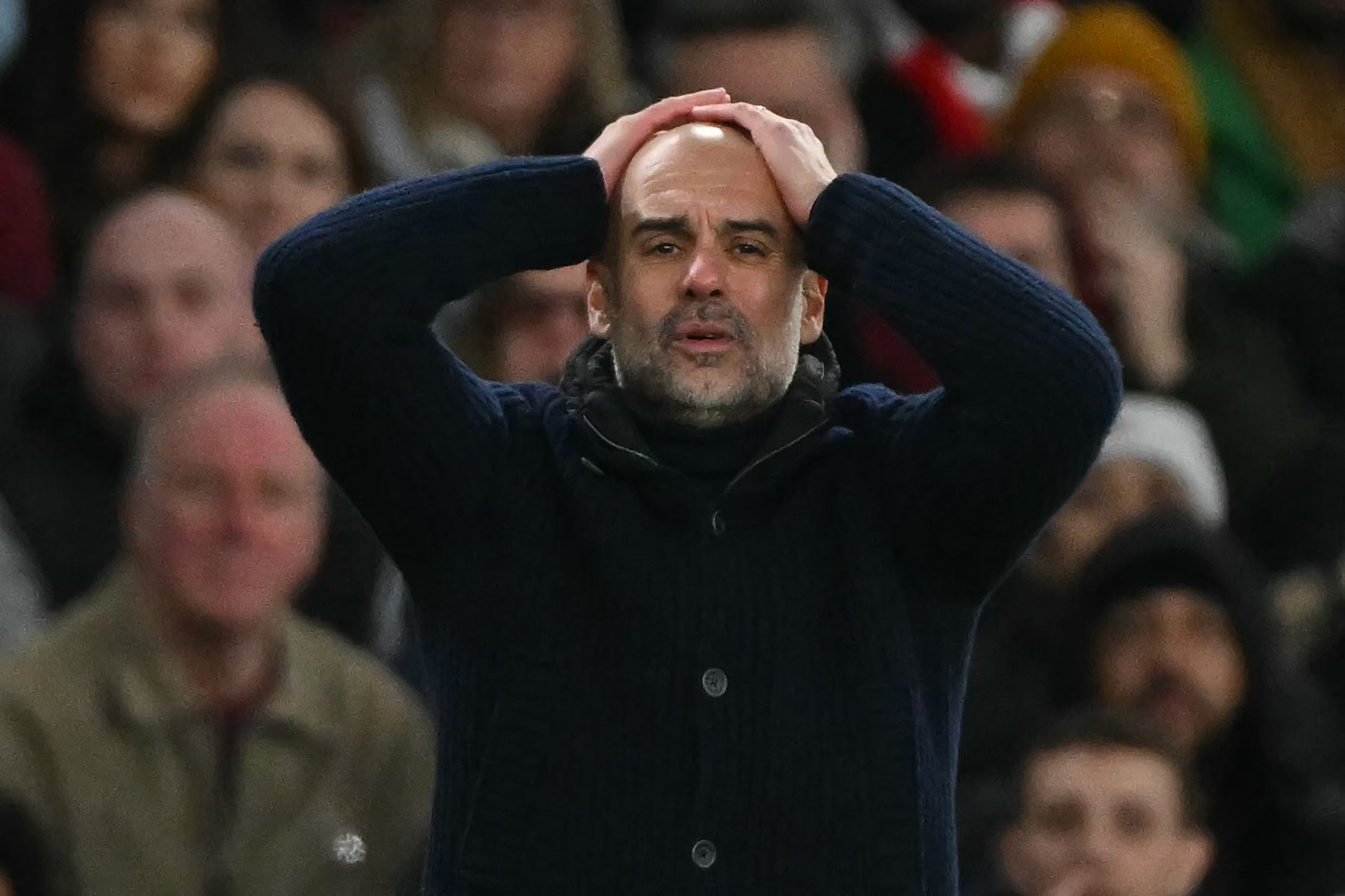 Manchester City's Spanish manager Pep Guardiola gestures on the touchline during the English Premier League football match between Arsenal and Manchester City at the Emirates Stadium in London on February 2, 2025. (Photo by Glyn KIRK / AFP) / RESTRICTED TO EDITORIAL USE. No use with unauthorized audio, video, data, fixture lists, club/league logos or 'live' services. Online in-match use limited to 120 images. An additional 40 images may be used in extra time. No video emulation. Social media in-match use limited to 120 images. An additional 40 images may be used in extra time. No use in betting publications, games or single club/league/player publications. /