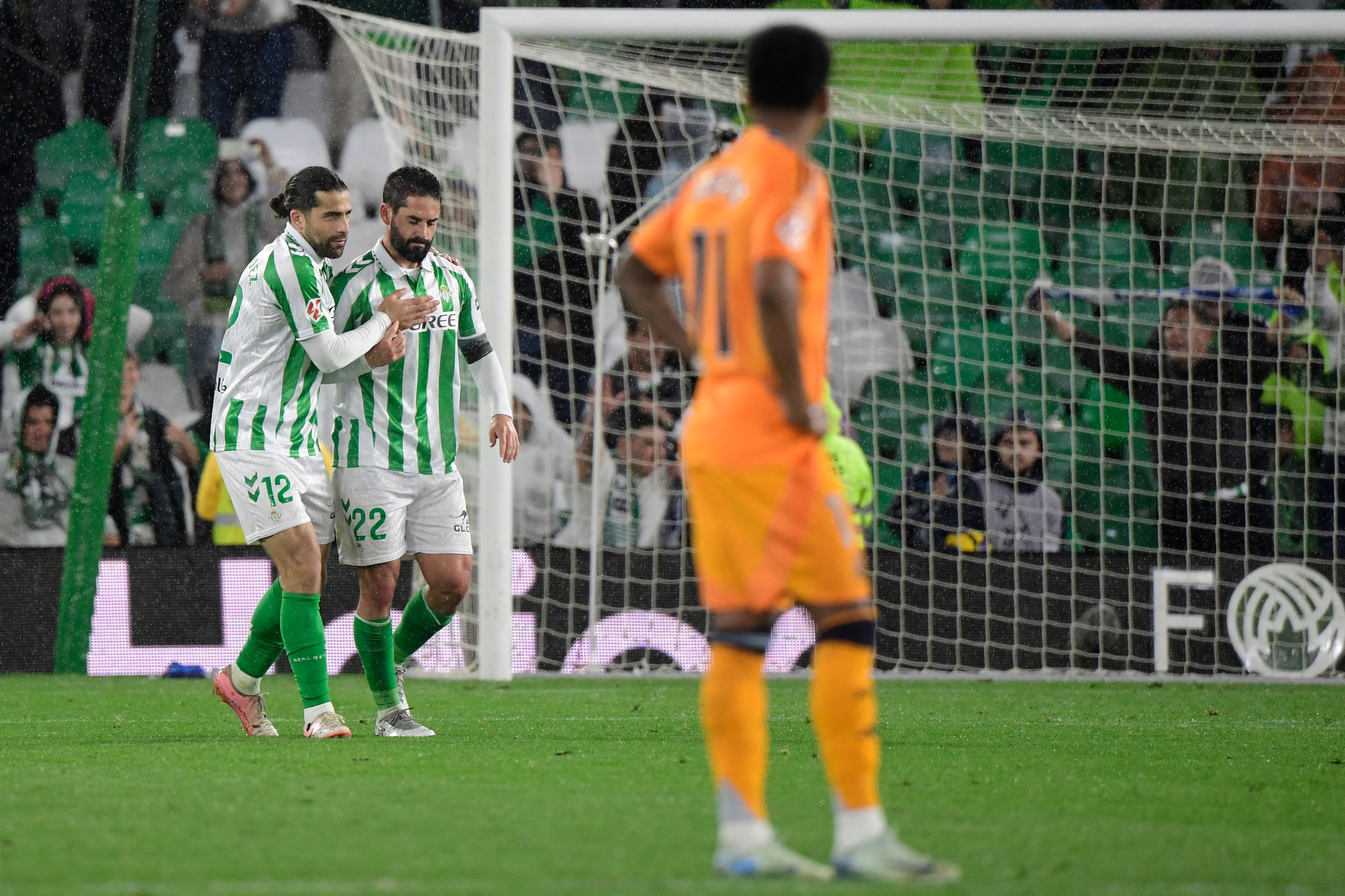 Real Betis' Spanish midfielder #22 Isco celebrates scoring his team's second goal during the Spanish league footbal match between Real Betis and Real Madrid CF at Benito Villamarin Stadium in Seville on March 1, 2025. (Photo by CRISTINA QUICLER / AFP)