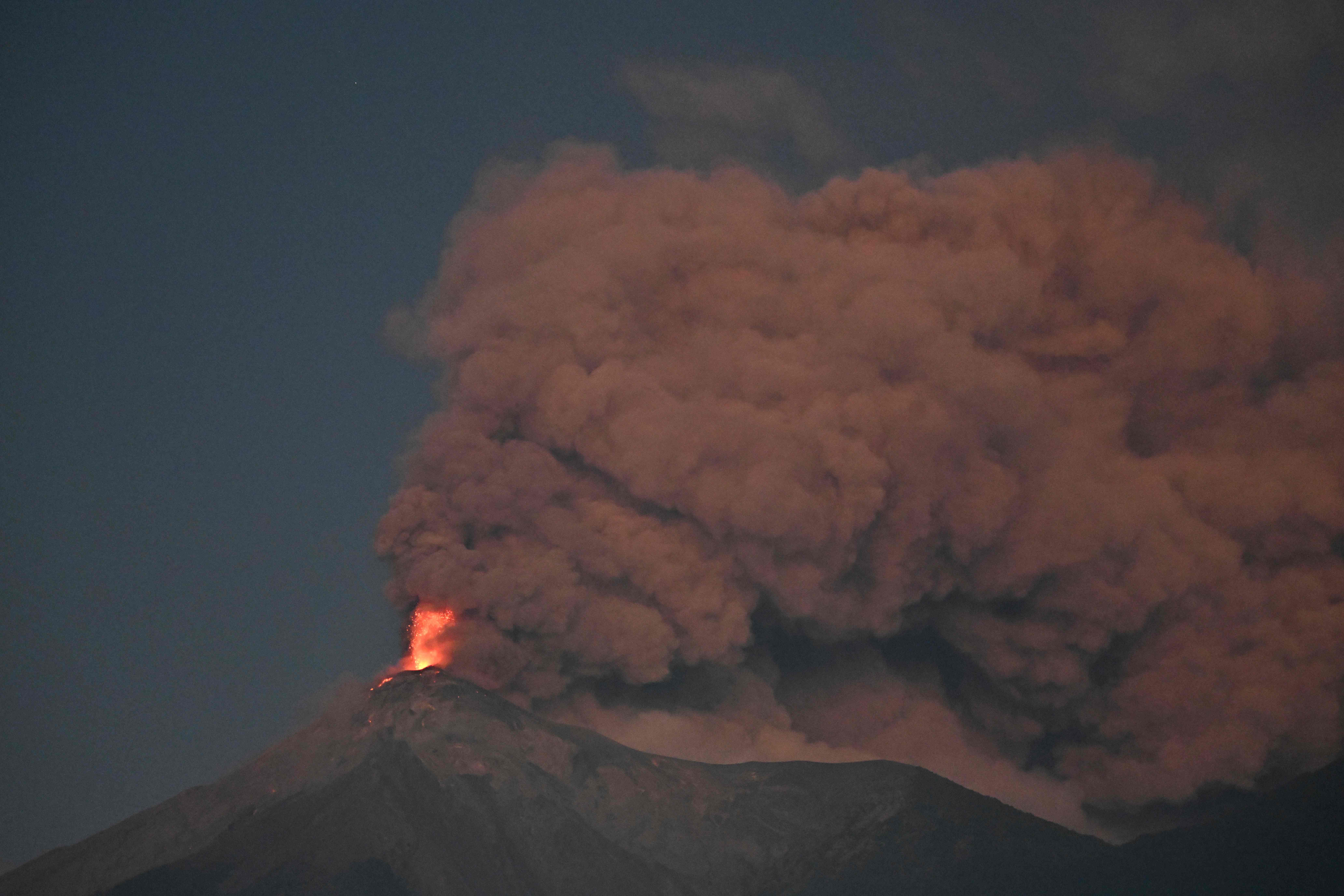 Fuego volcano erupts as seen from Alotenango, Sacatepequez department, some 65 kilometres southwest Guatemala City on March 10, 2025. Nearly a thousand people were evacuated early Monday morning following a new eruption of the Fuego volcano in Guatemala, near the capital and considered the most active in Central America. (Photo by JOHAN ORDONEZ / AFP)