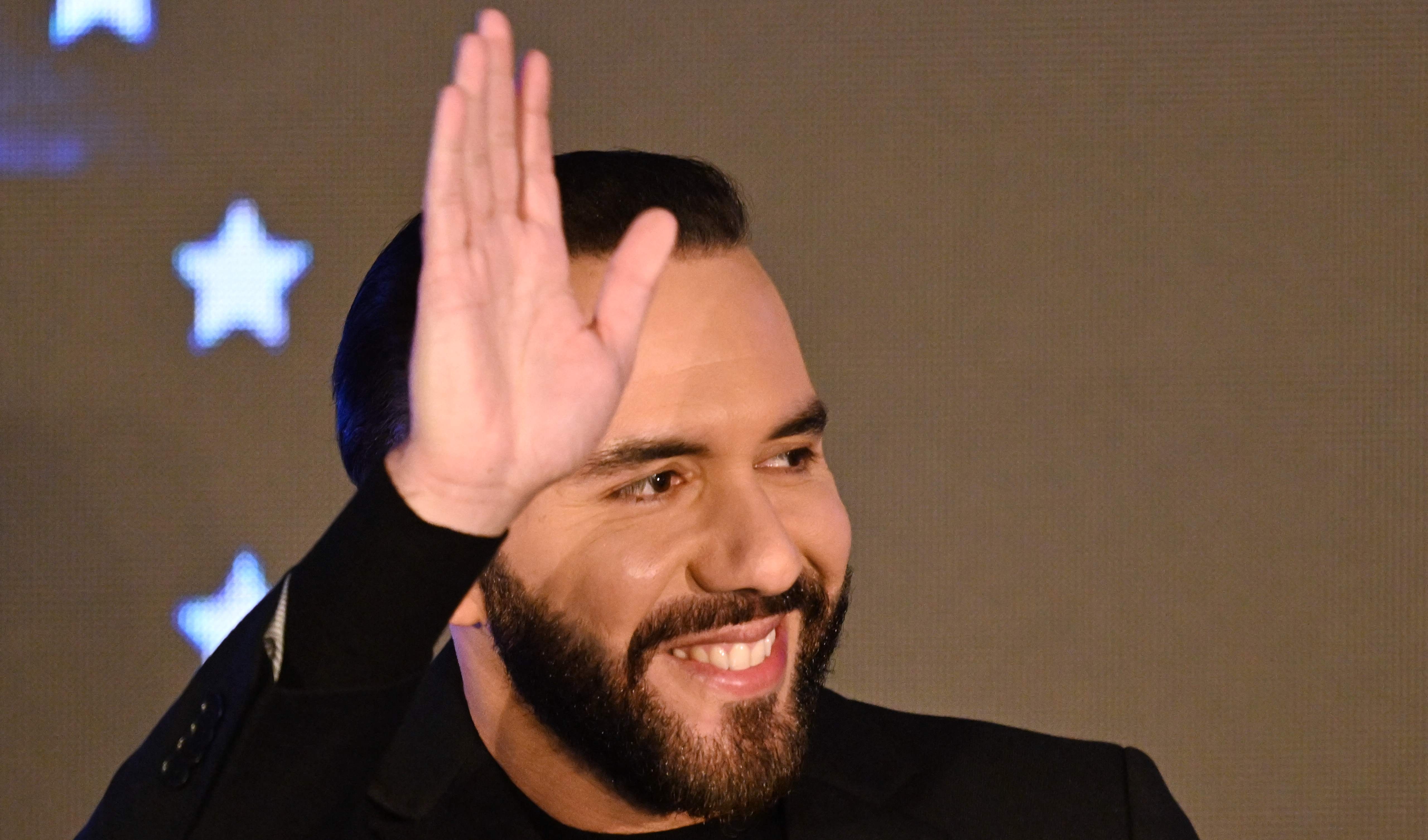 El Salvador's President Nayib Bukele waves during the inauguration of the Key Institute, a private institution of higher education specializing in engineering and science in San Salvador on March 19, 2025. (Photo by Marvin RECINOS / AFP)
