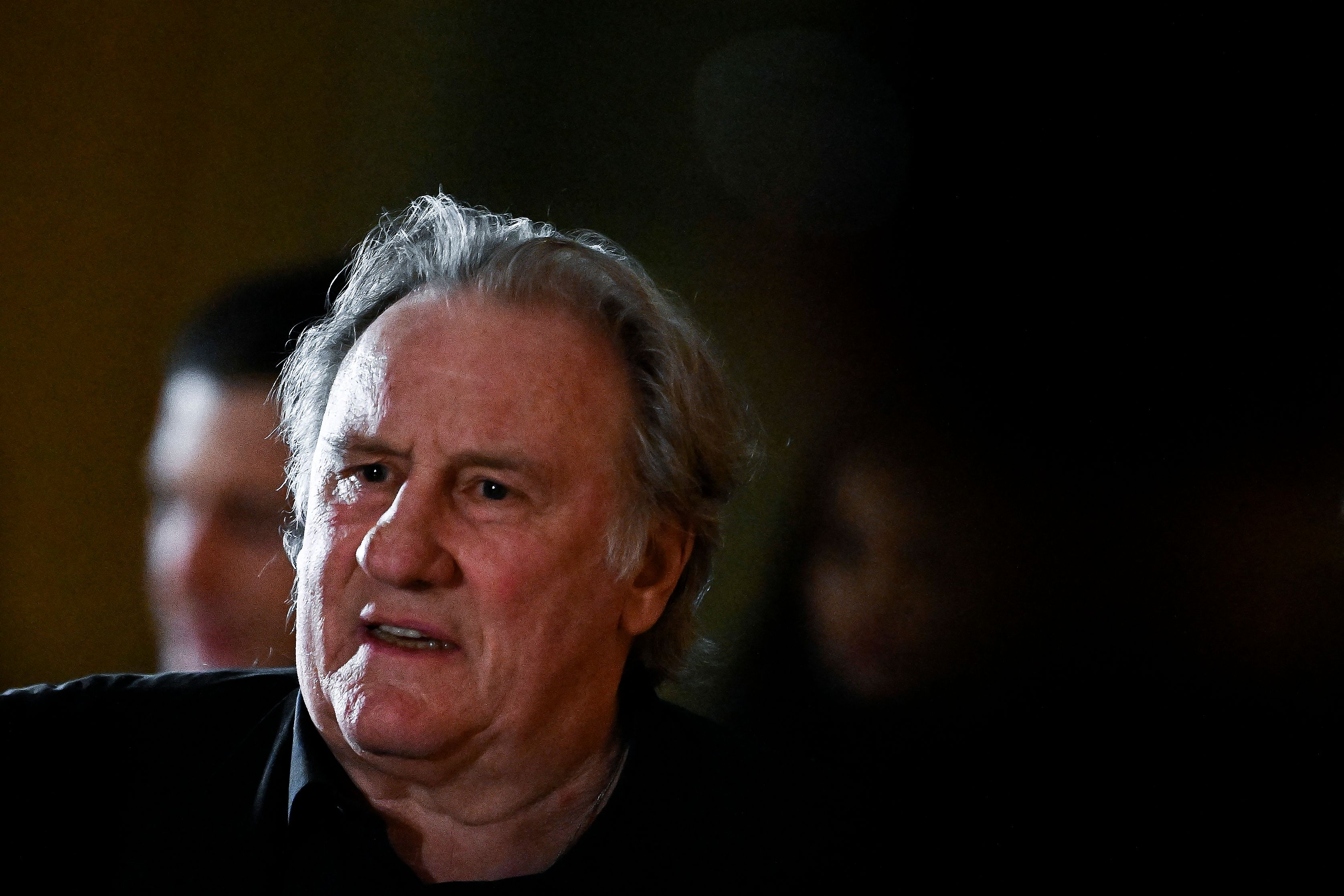 French actor Gerard Depardieu leaves during his trial in which he is accused of sexually abusing two women during a film shoot in 2021, at the Paris criminal court in the Tribunal de Paris courthouse, on March 24, 2025. Depardieu, 76, who has made more than 200 films and television series, has been accused of improper behaviour by around 20 women but this is the first case to come to trial. The two plaintiffs -- Amelie, 54, a set dresser, and Sarah (name changed), 34, an assistant director -- allege sexual assault during the filming in 2021 of "Les Volets Verts" ("The Green Shutters") by director Jean Becker. (Photo by JULIEN DE ROSA / AFP)