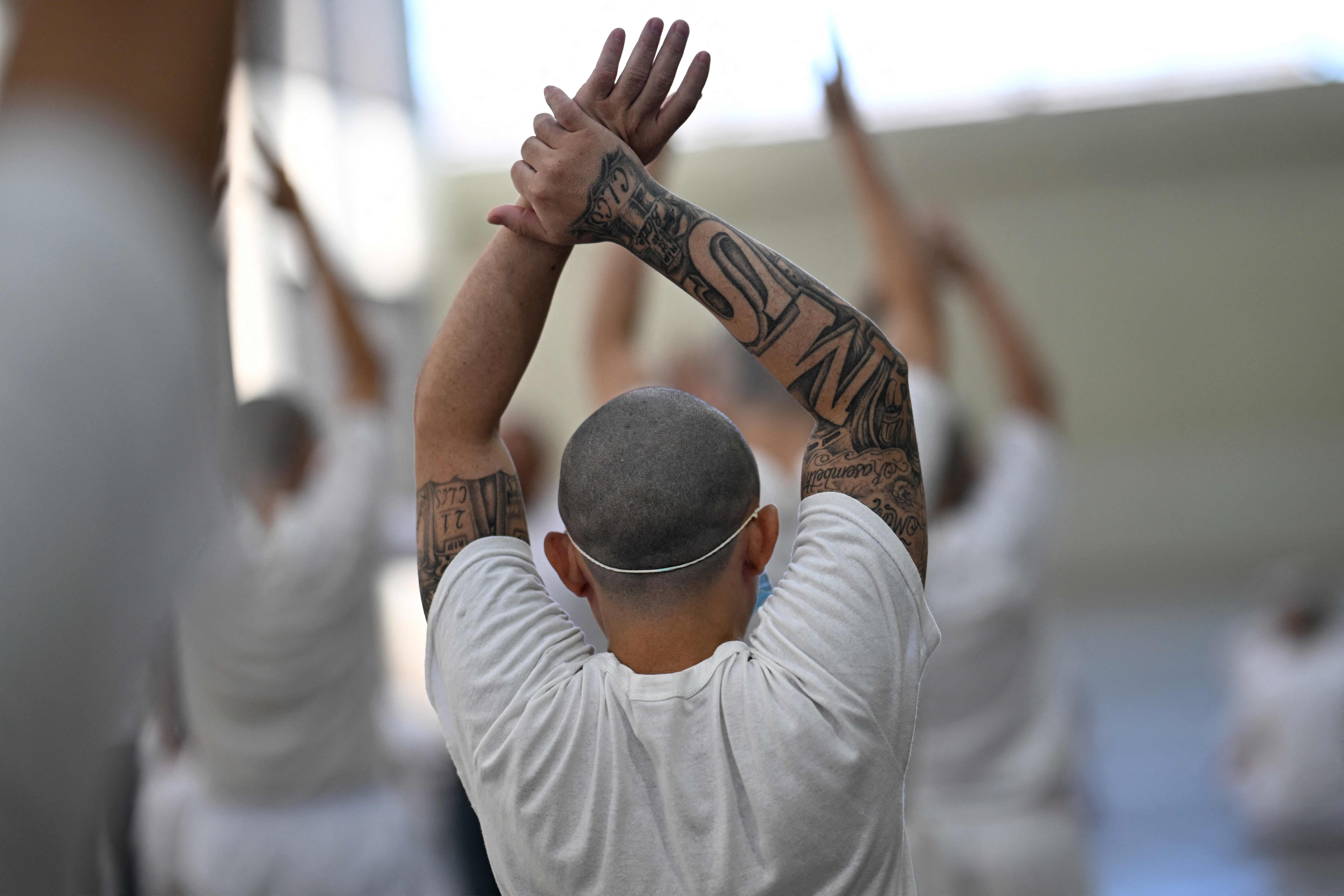 Inmates exercise at the Counter-Terrorism Confinement Centre (CECOT) mega-prison, where hundreds of members of the MS-13 and 18 Street gangs are being held, in Tecoluca, El Salvador on January 27, 2025. The CECOT, the largest prison in Latin America and emblem of the war against gangs of the government of President Nayib Bukele, celebrates two years since it was inaugurated on February 1. (Photo by Marvin RECINOS / AFP)
