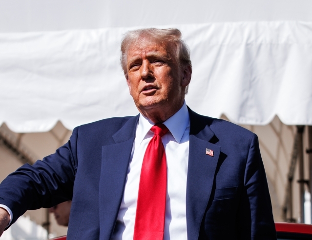 US President Trump views Tesla vehilces in front of the White House