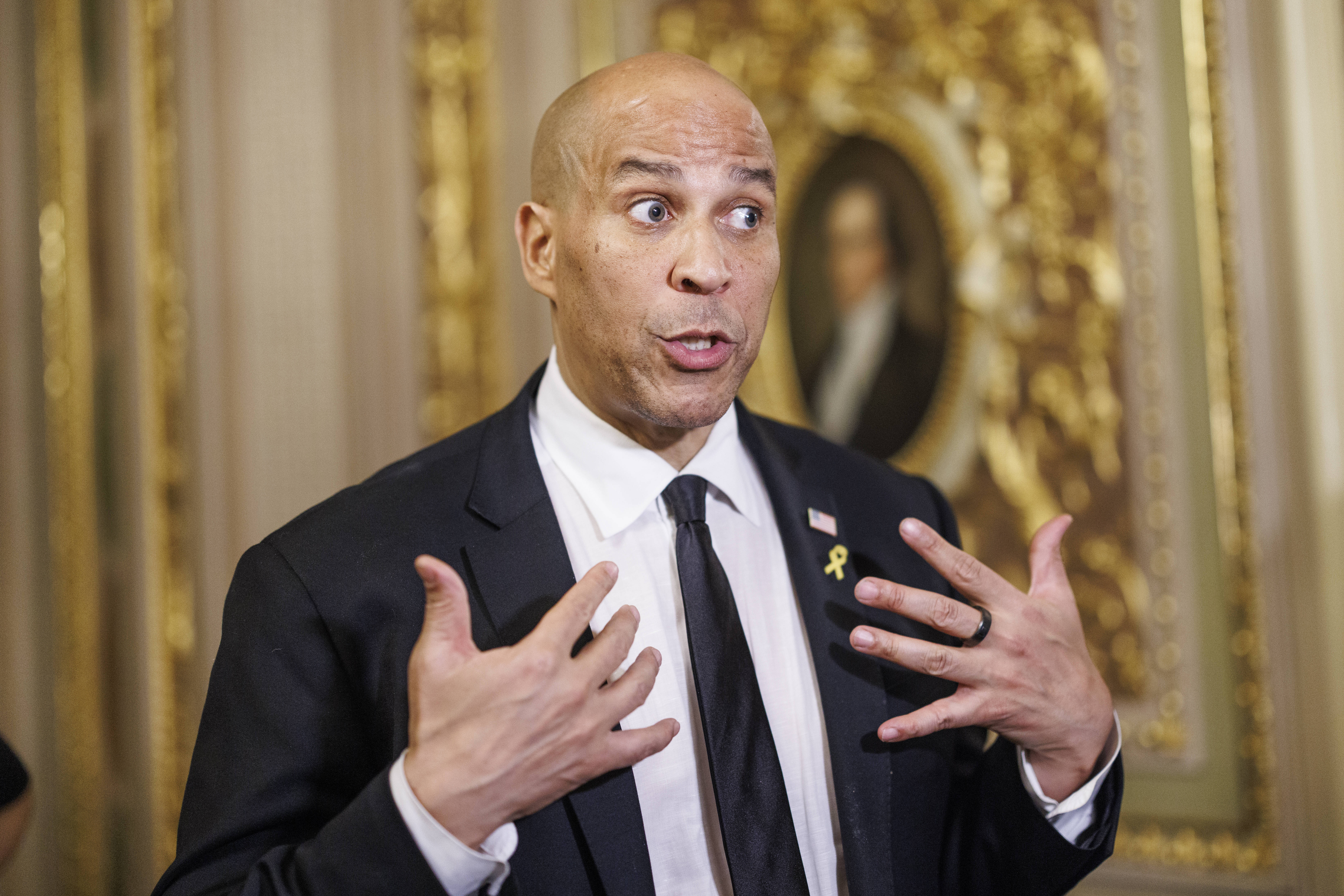 WASHINGTON (United States), 01/04/2025.- US Senator Cory Booker (Democrat of New Jersey) speaks to the media off the Senate floor after completing a record-breaking 25-hour, 5-minute filibuster in opposition to US President Trumps agenda in Washington, DC, USA, 01 April 2025.  EFE/EPA/AARON SCHWARTZ