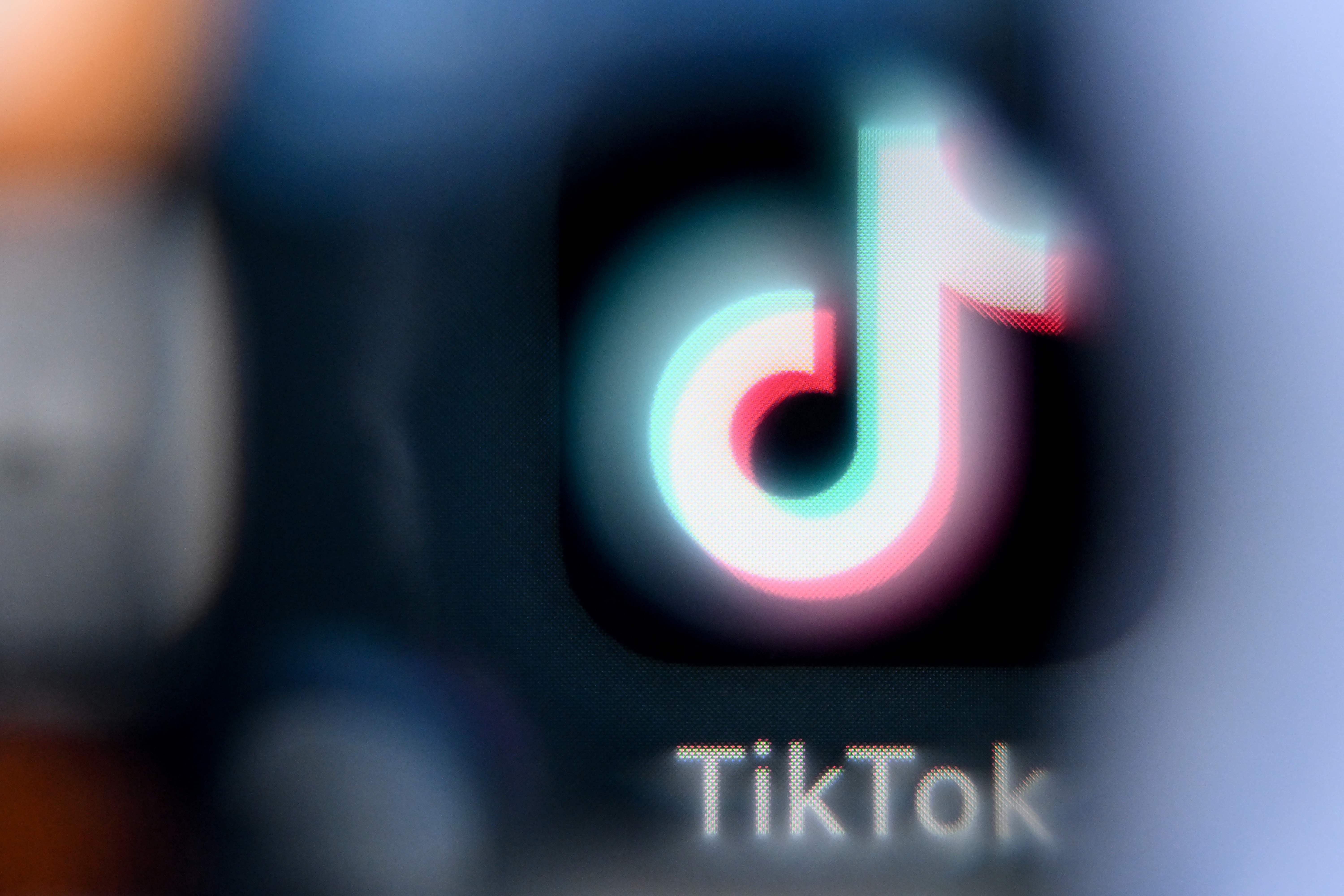 A photo taken on April 10, 2025 shows the Chinese social networking service TikTok's logo on a smartphone screen in Frankfurt am Main, western Germany. US President Donald Trump said on April 6, 2025 that China would have agreed to a deal on the sale of TikTok if it were not for the tariffs imposed by Washington on Beijing last week. (Photo by Kirill KUDRYAVTSEV / AFP)